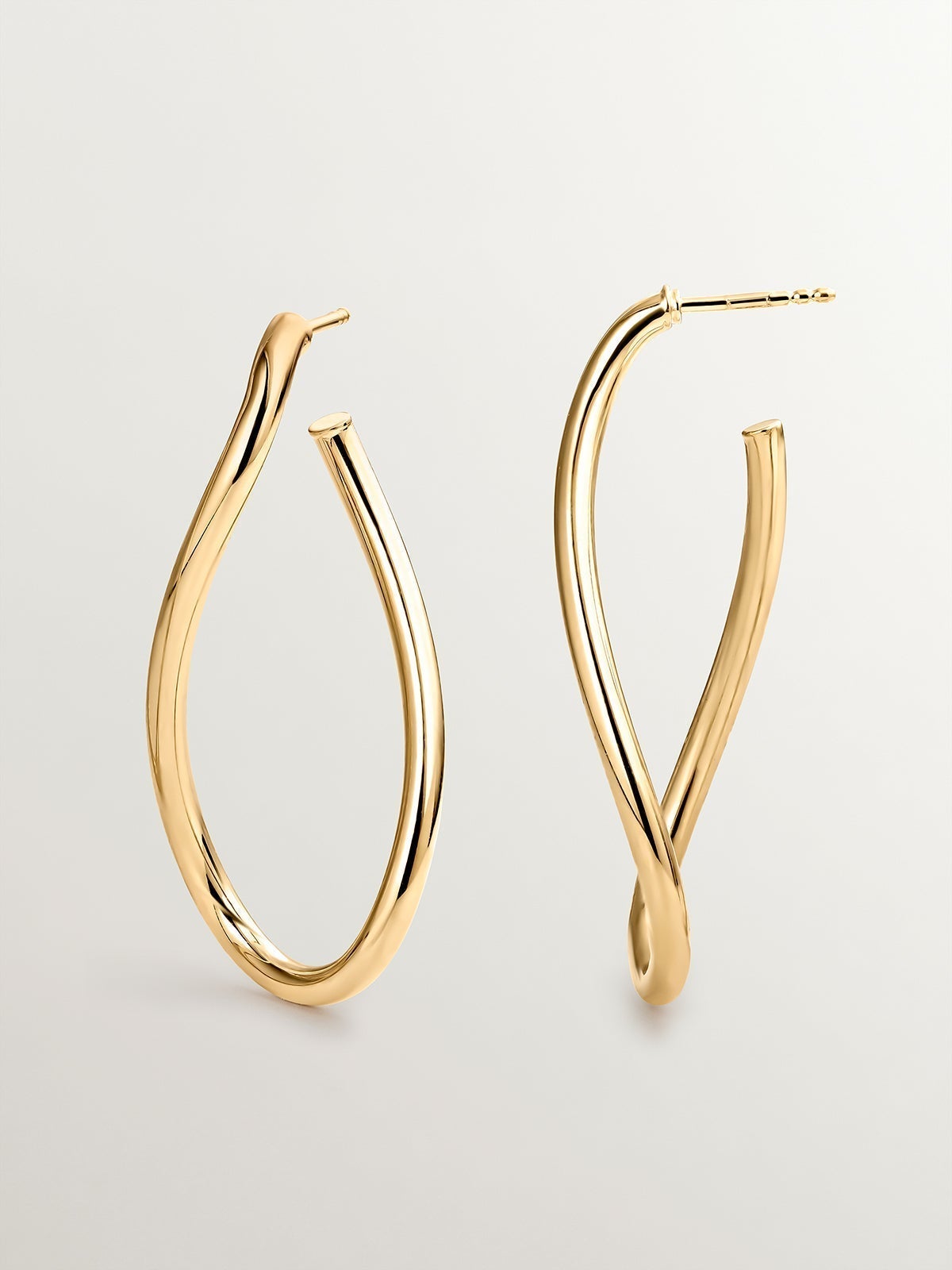 Large wavy hoop earrings made of 925 silver plated in 18K yellow gold