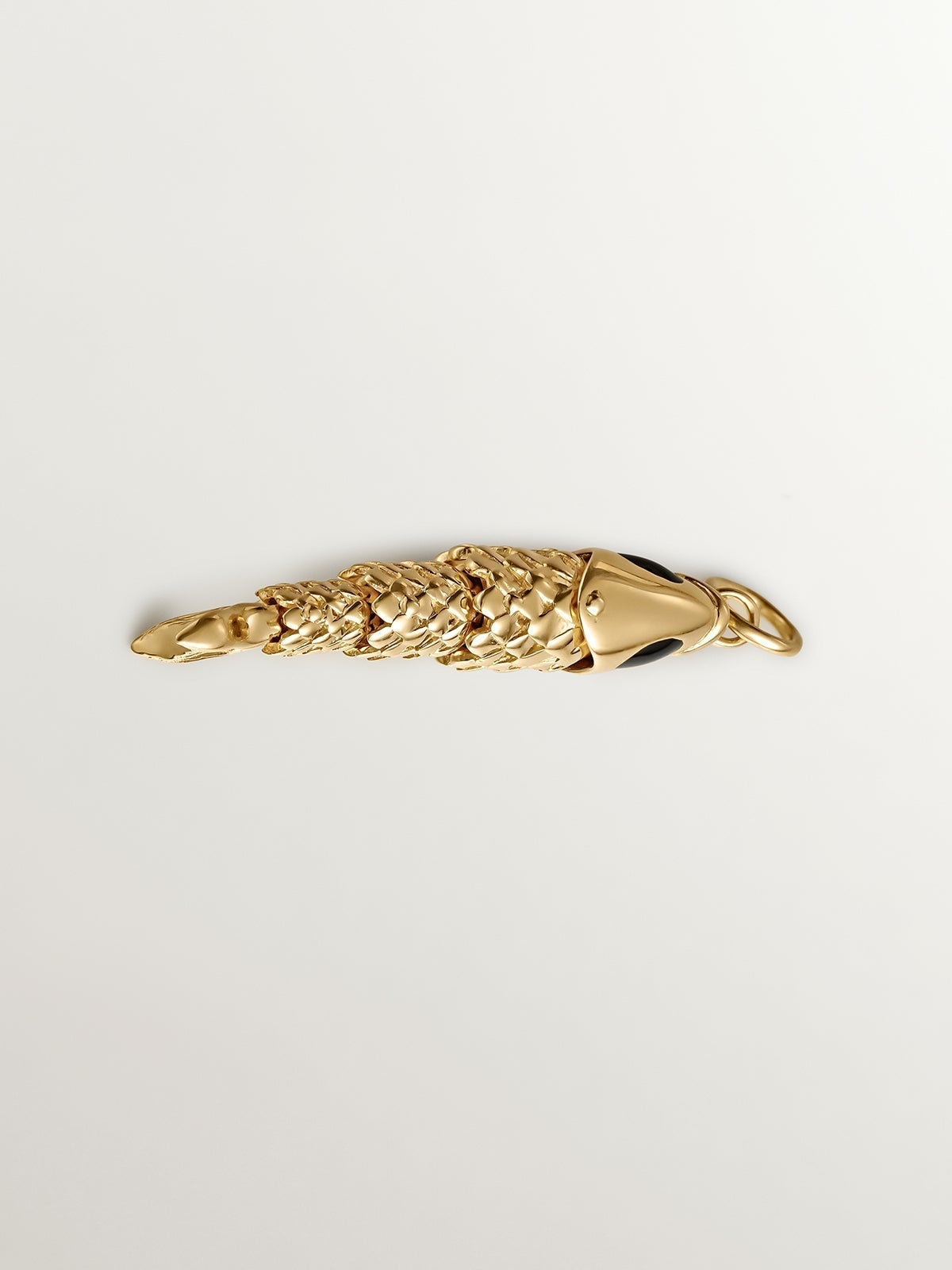 925 Silver charm bathed in 18K yellow gold with black enamel and fish shape.