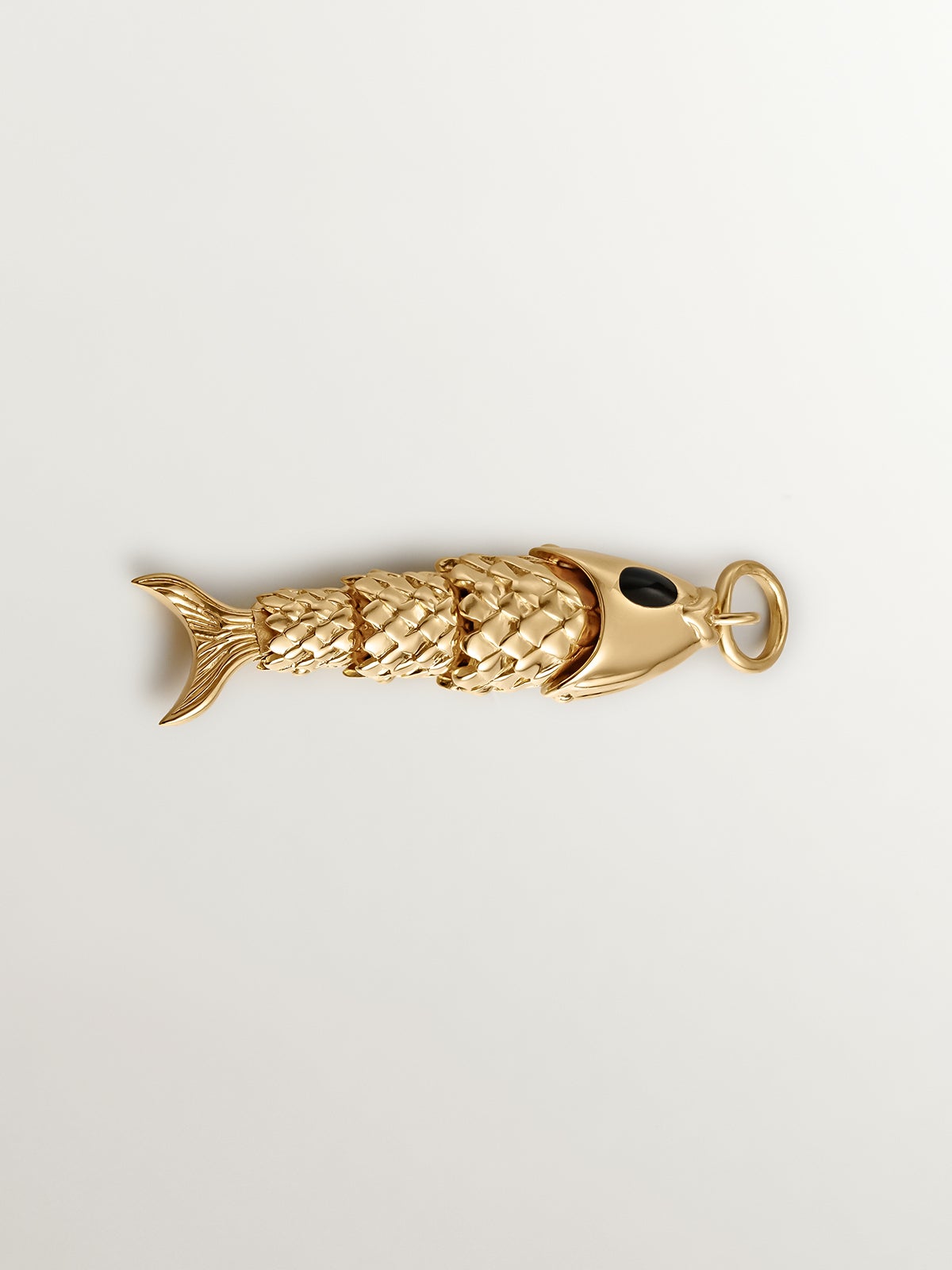 925 Silver charm bathed in 18K yellow gold with black enamel and fish shape.