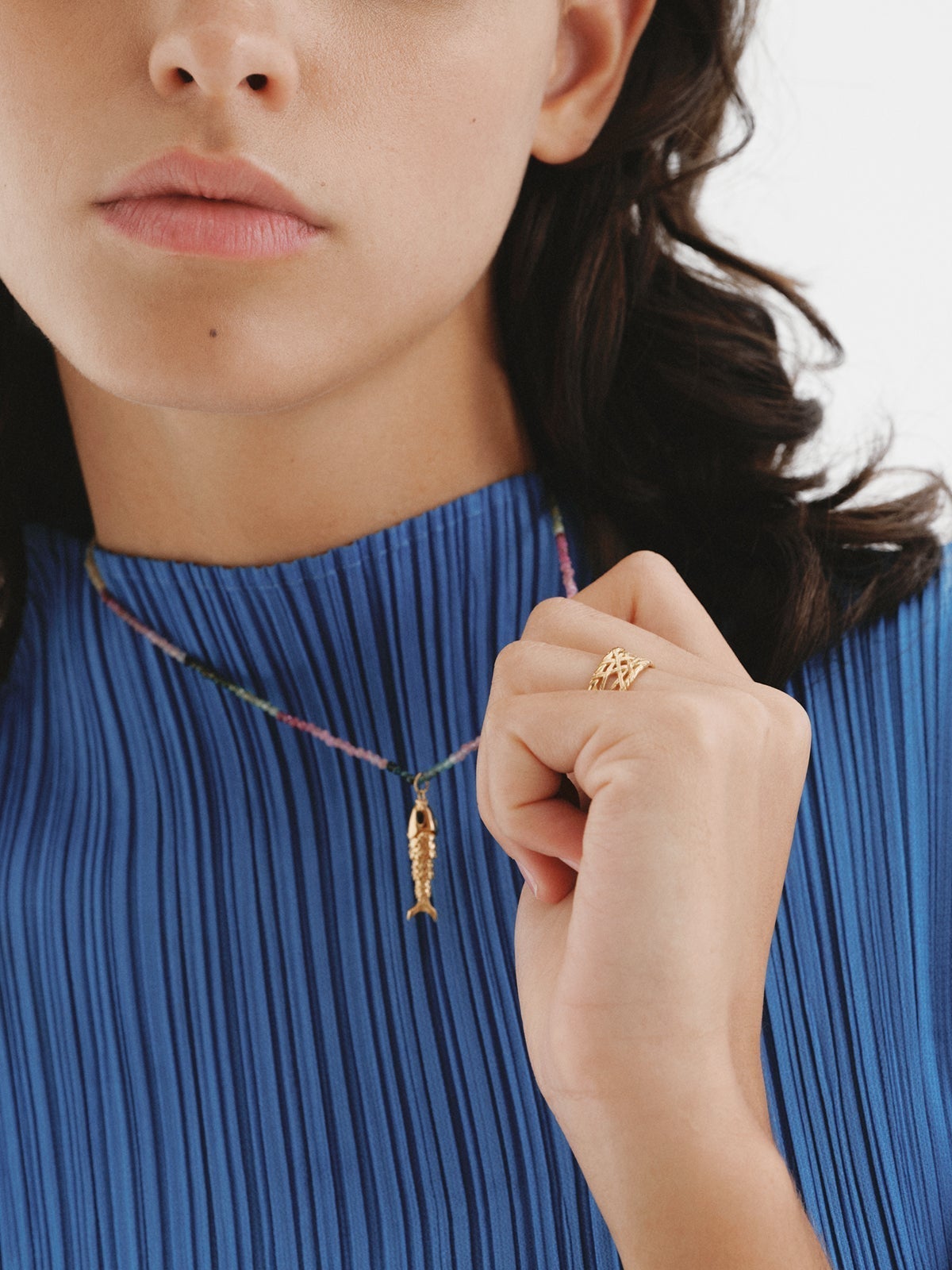925 Silver charm bathed in 18K yellow gold with black enamel and fish shape.