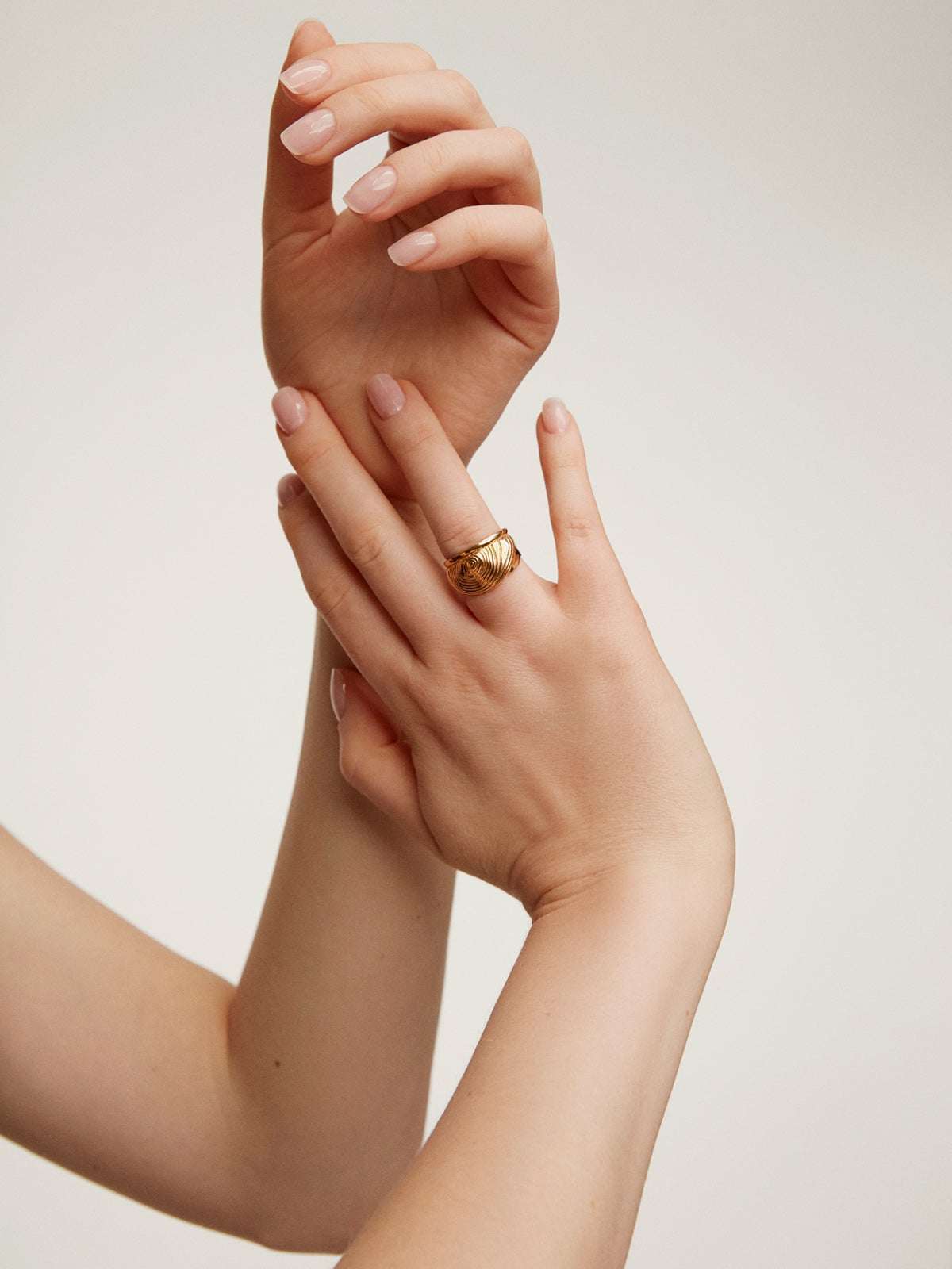 Wide 925 silver ring bathed in 18K yellow gold with embossed and irregular shape