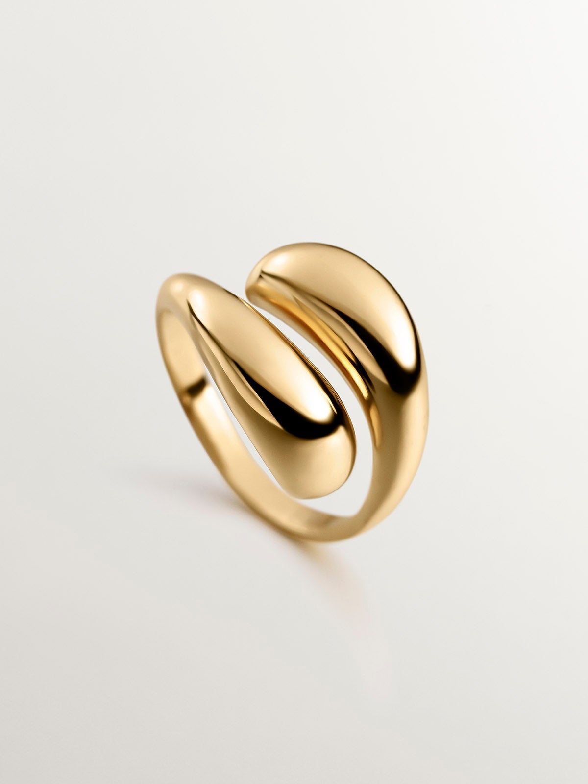You and Me ring made of 925 silver, bathed in 18K yellow gold with a domed spiral shape.