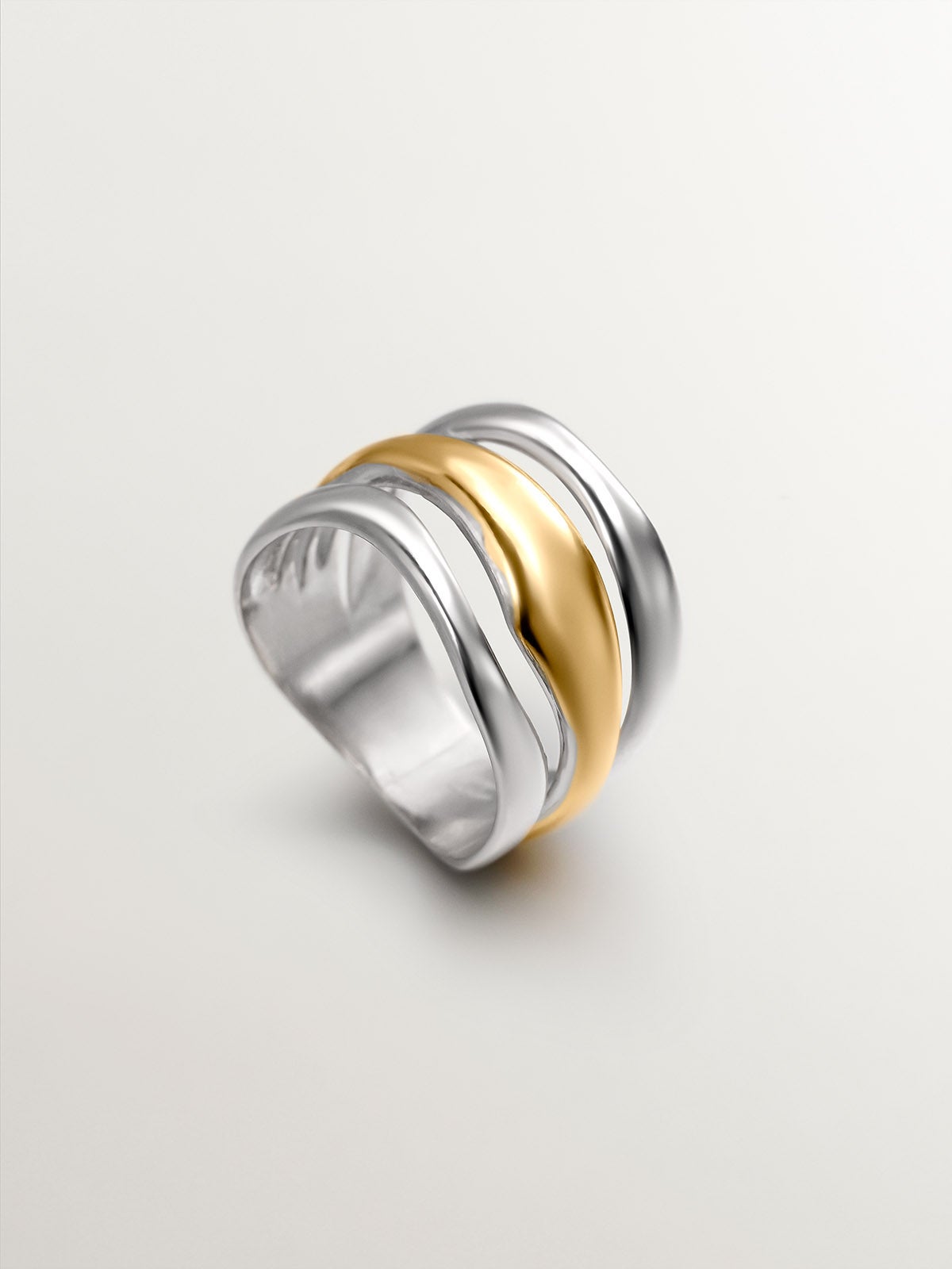 Bicolor triple ring made of 925 silver and 925 silver bathed in 18K yellow gold.