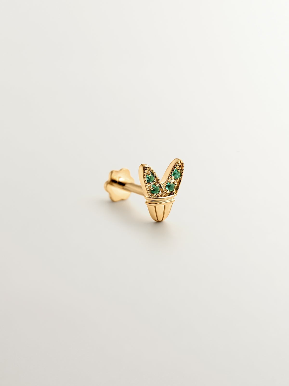 18K yellow gold piercing with emeralds and wing shape