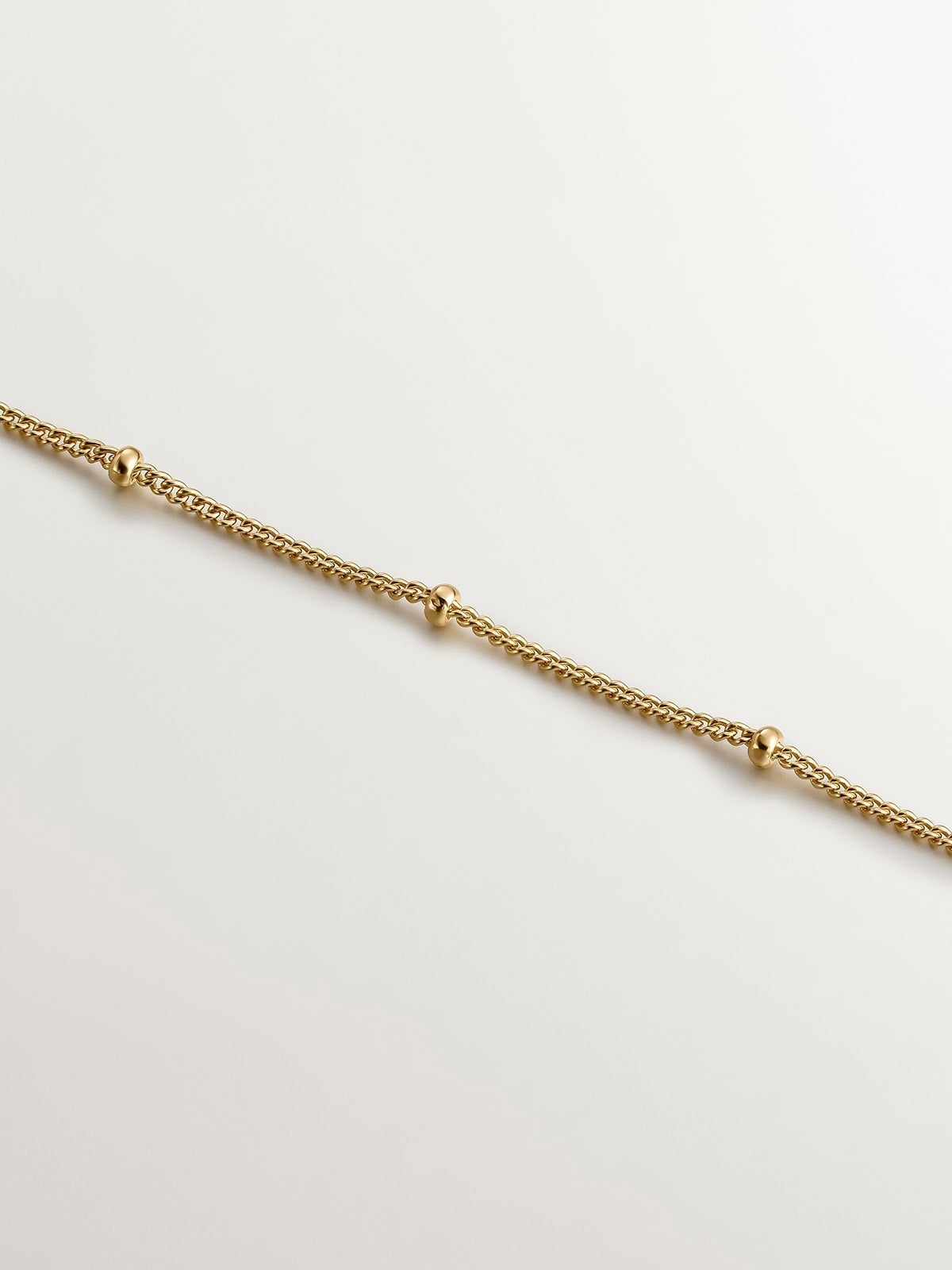 925 Silver pendant bathed in 18K yellow gold with a moon and white topazes.