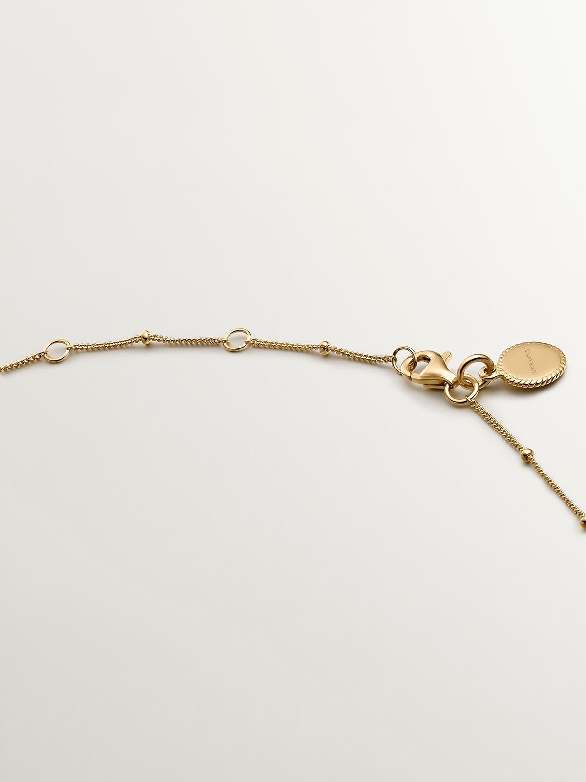 925 Silver pendant bathed in 18K yellow gold with a moon and white topazes.