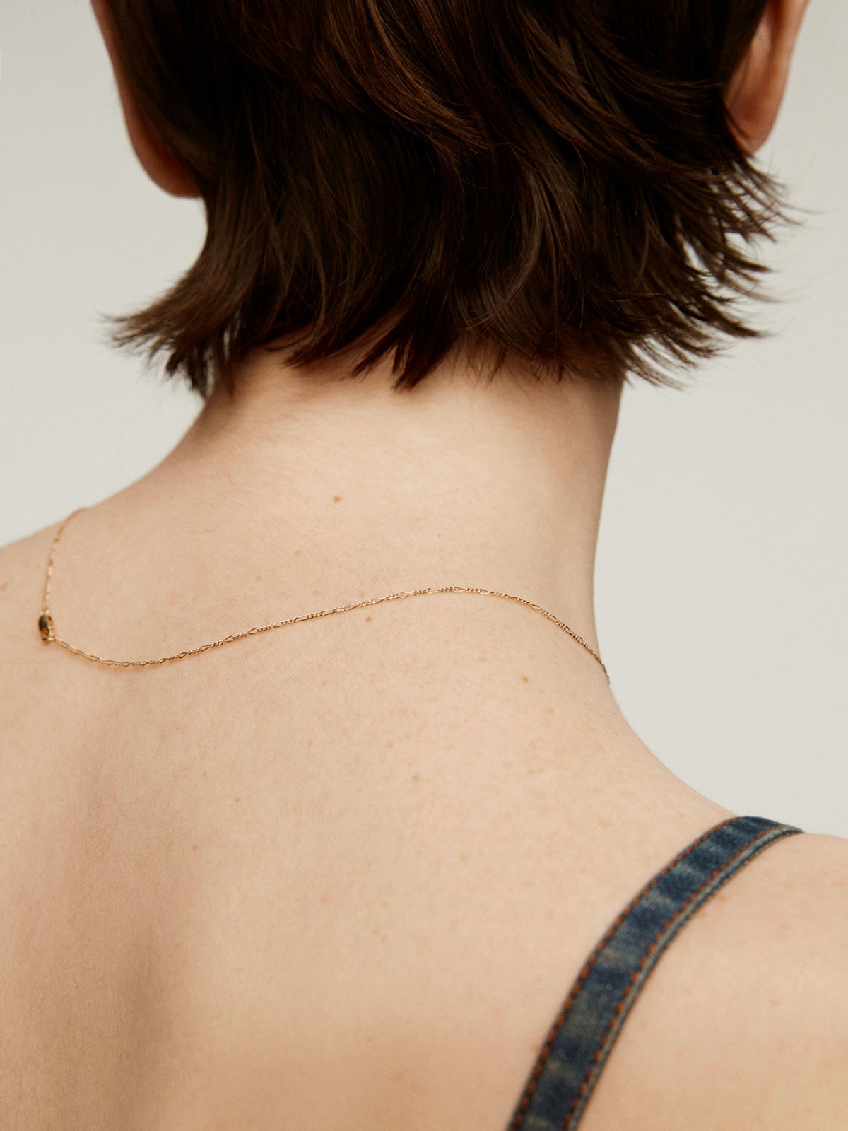 Fine Figaro link chain in 9K yellow gold