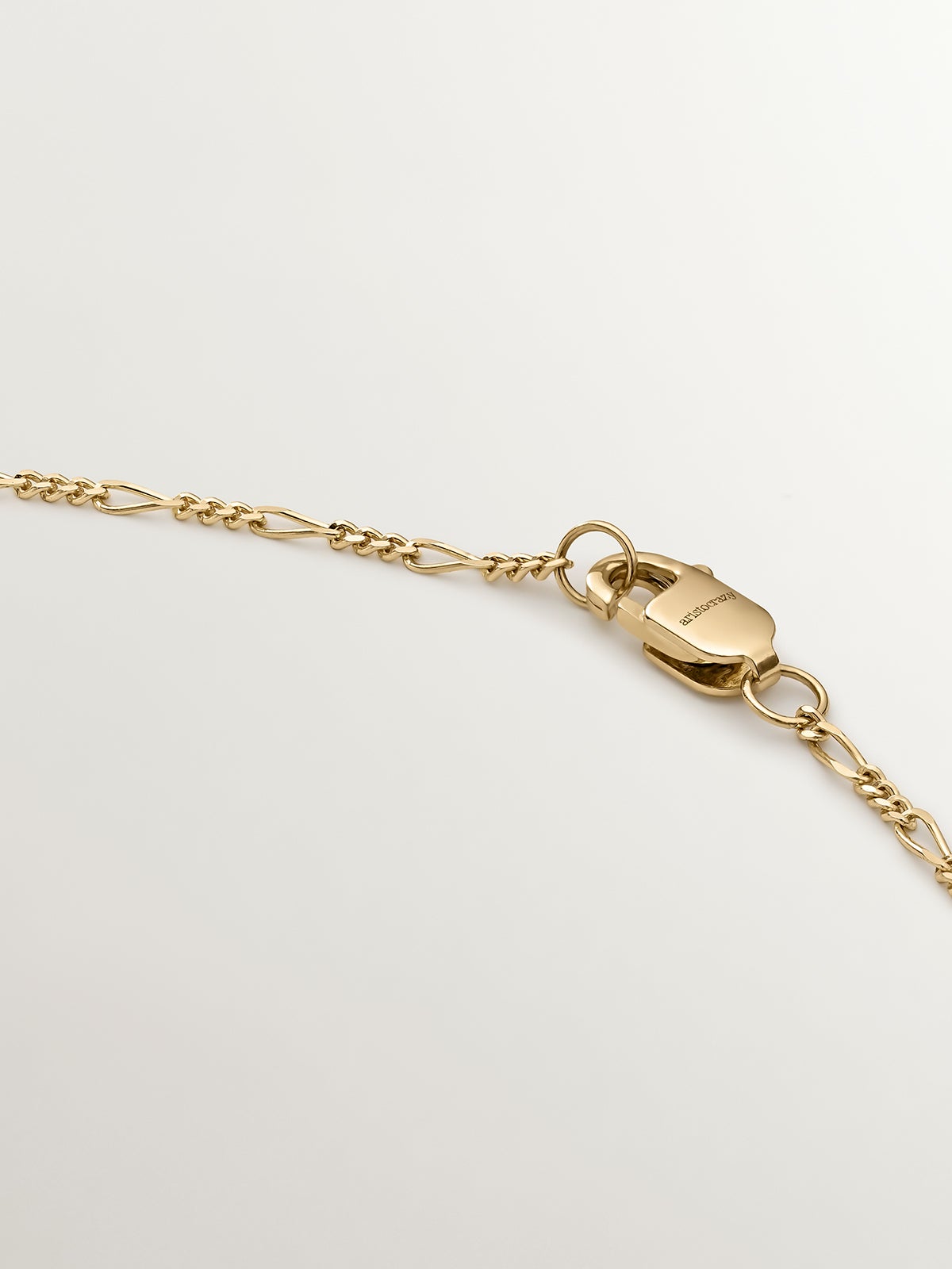 Fine Figaro link chain in 9K yellow gold
