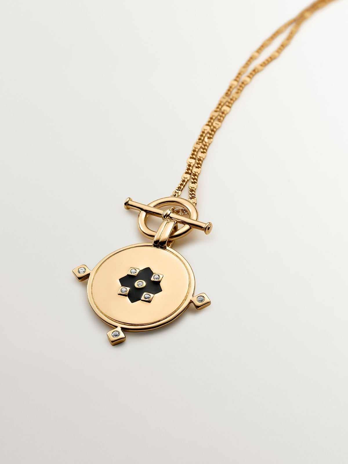 18K yellow gold plated 925 sterling silver pendant with medal, white topaz and black enamel