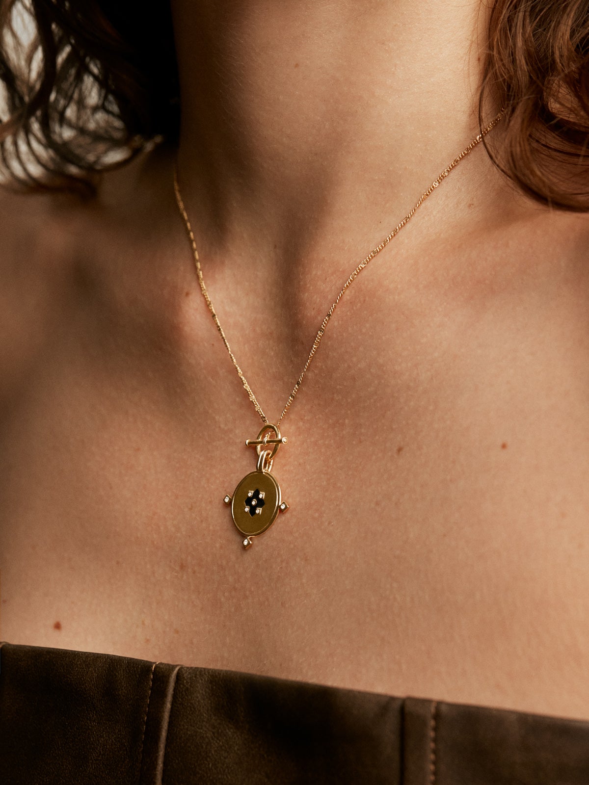 18K yellow gold plated 925 sterling silver pendant with medal, white topaz and black enamel