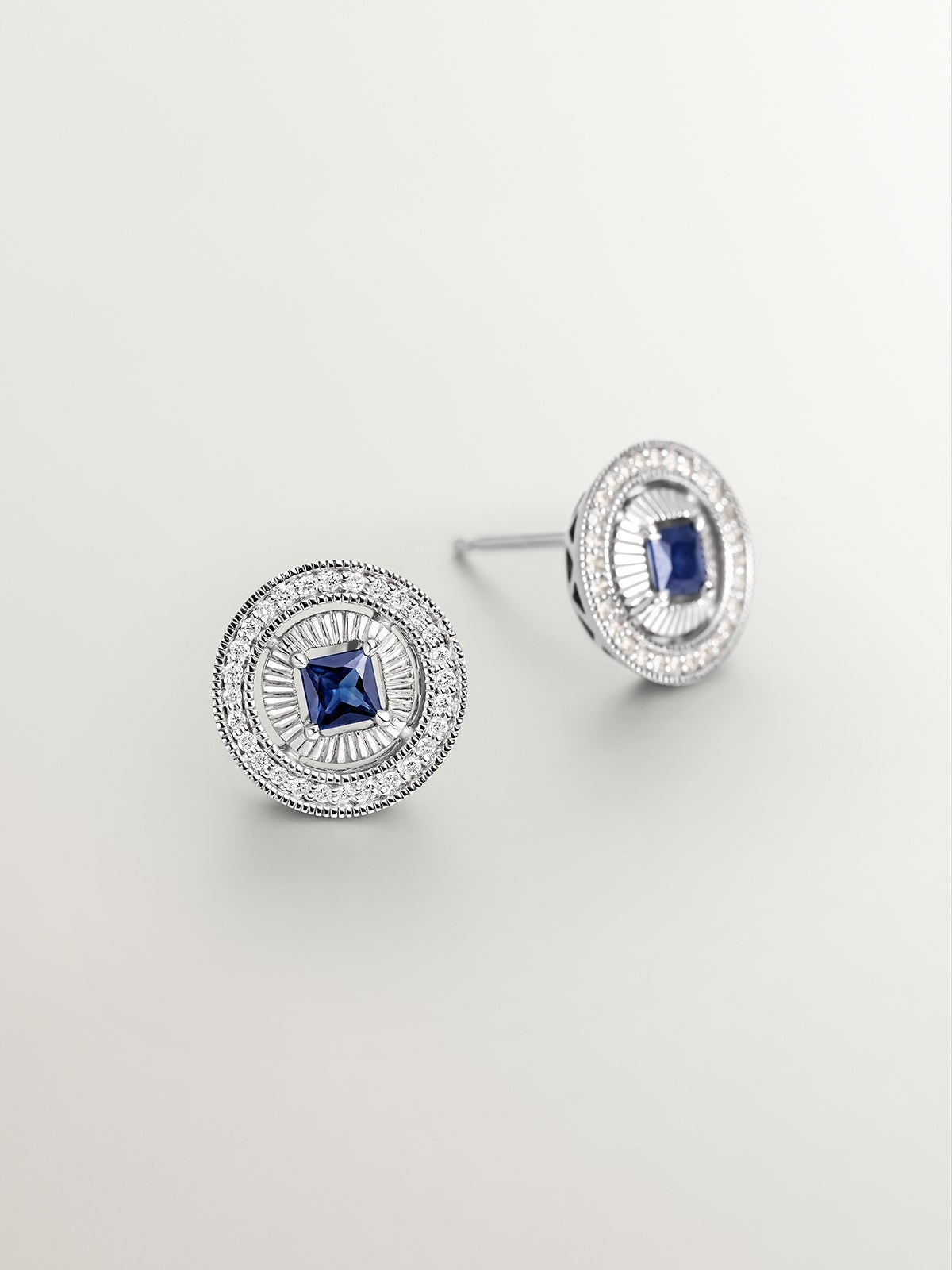 18K white gold earrings with brilliant-cut diamonds and princess-cut blue sapphires