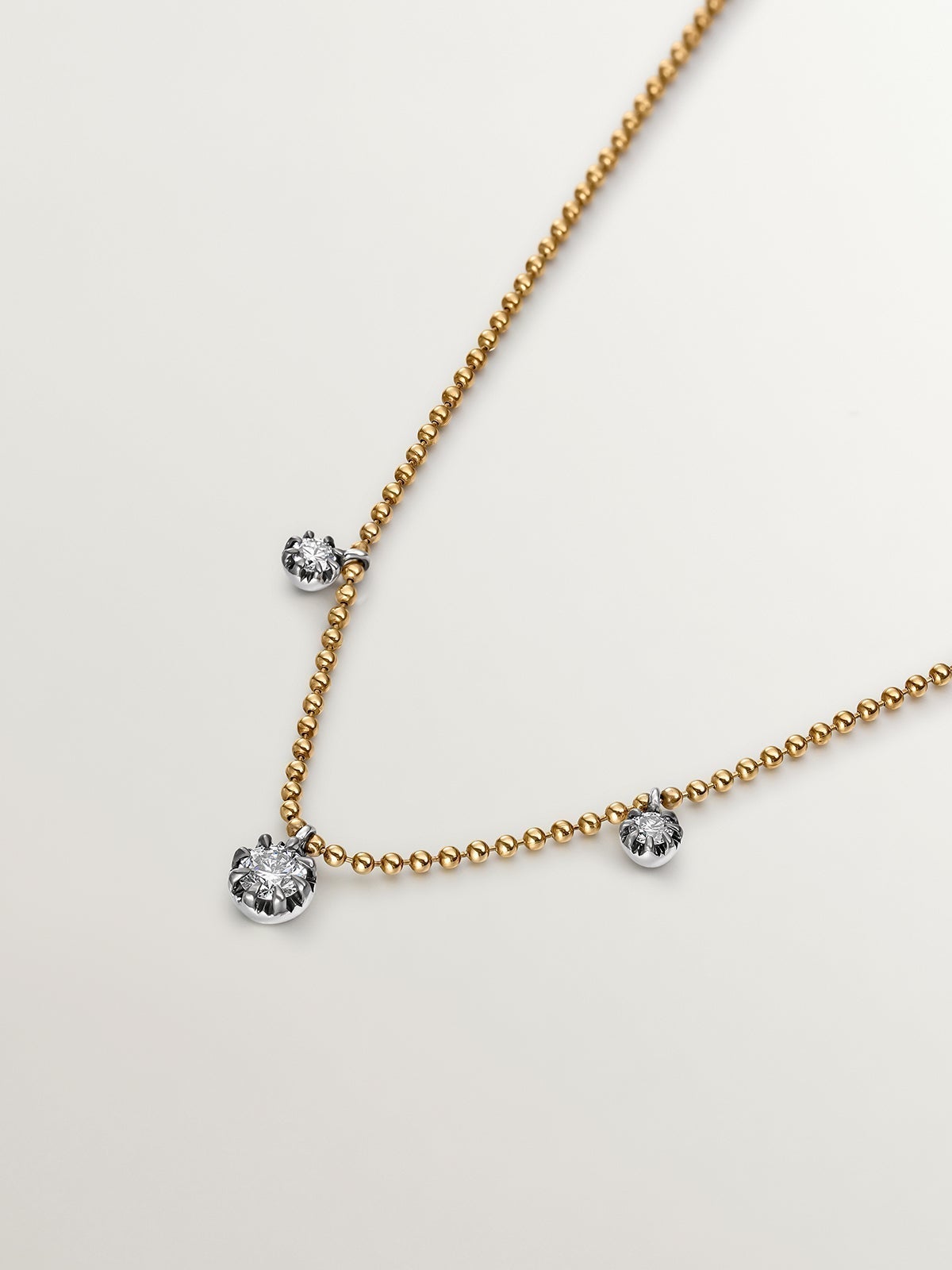 18K yellow gold necklace with aged effect and brilliant-cut diamonds