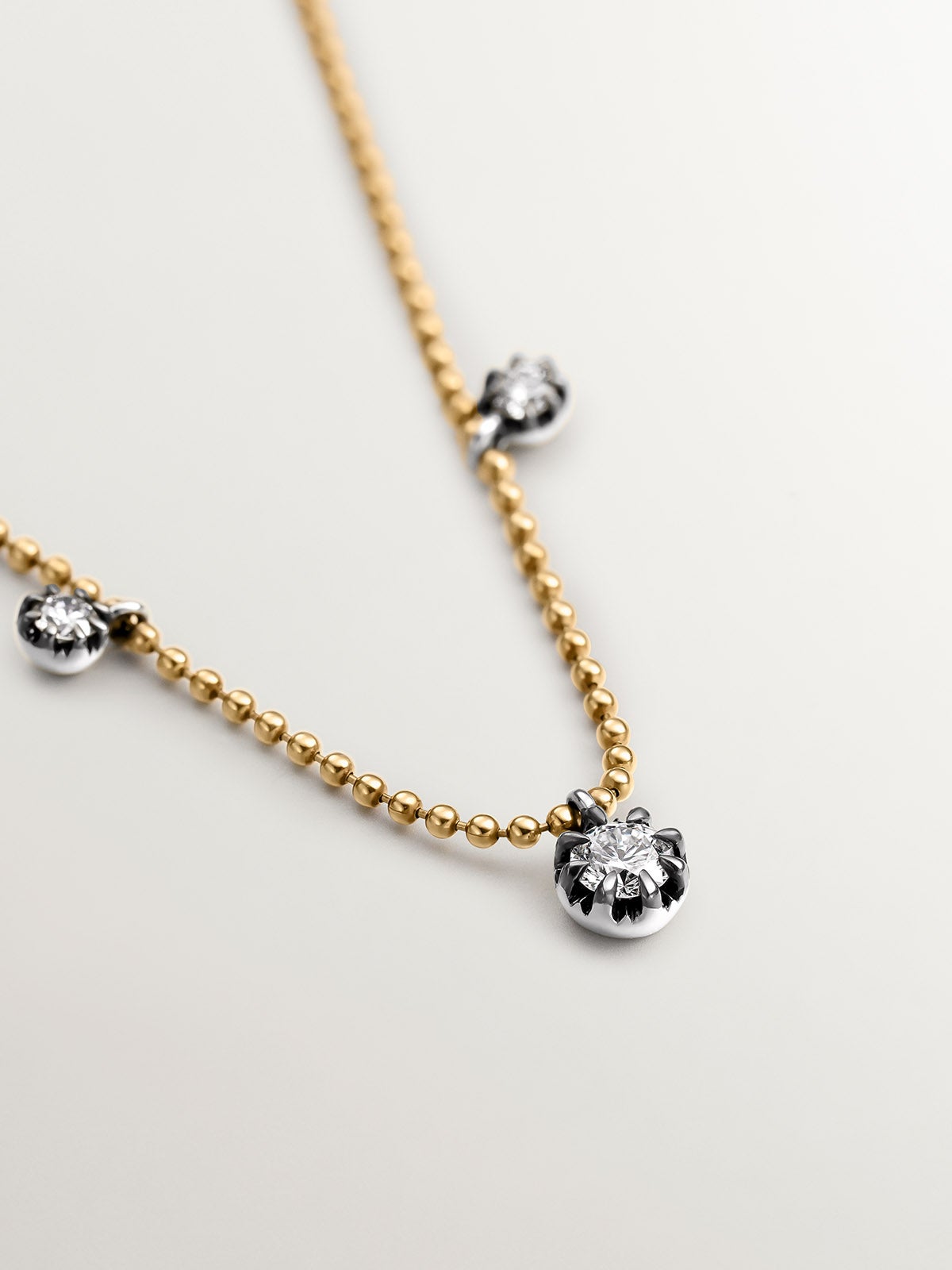 18K yellow gold necklace with aged effect and brilliant-cut diamonds