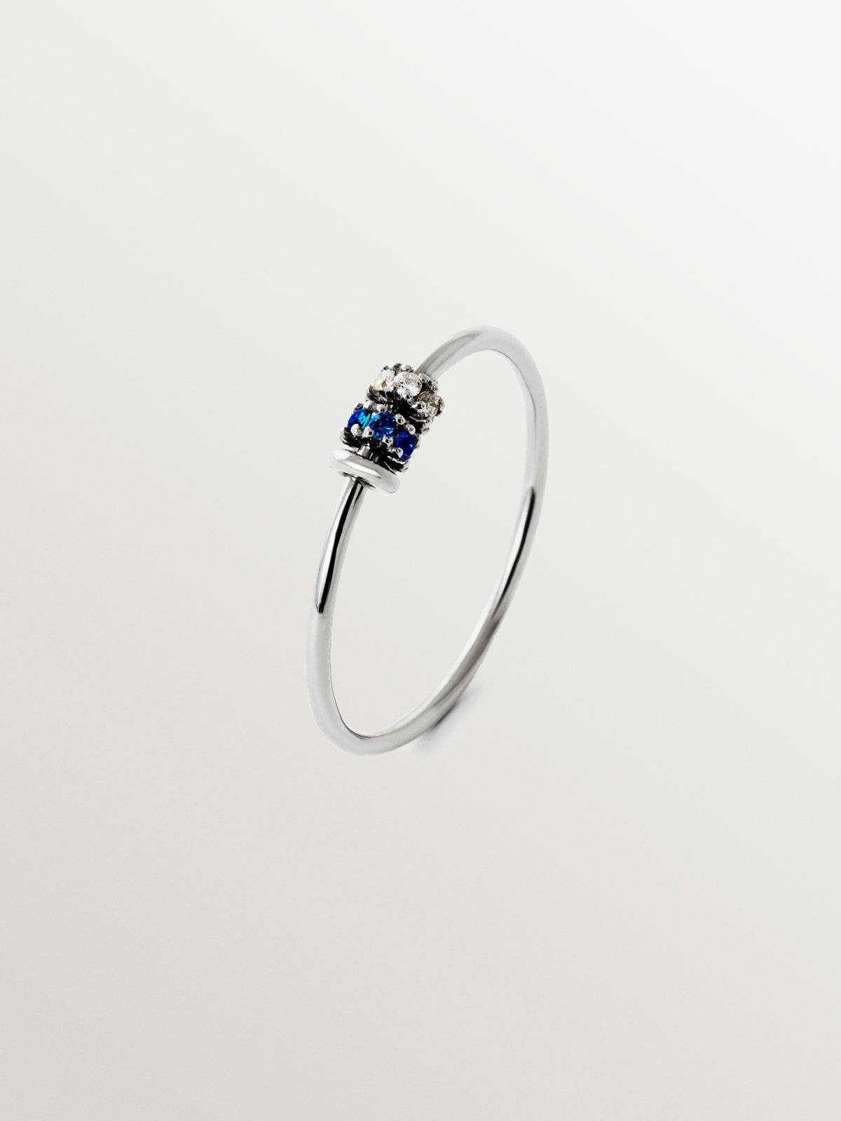 9K white gold ring with blue sapphires and diamonds