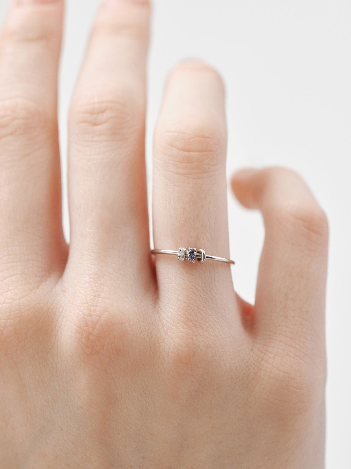 9K white gold ring with blue sapphires and diamonds