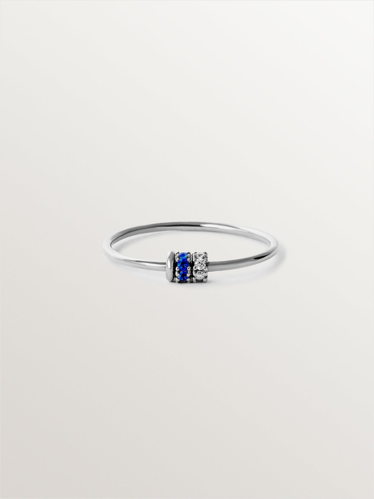 9K white gold ring with blue sapphires and diamonds