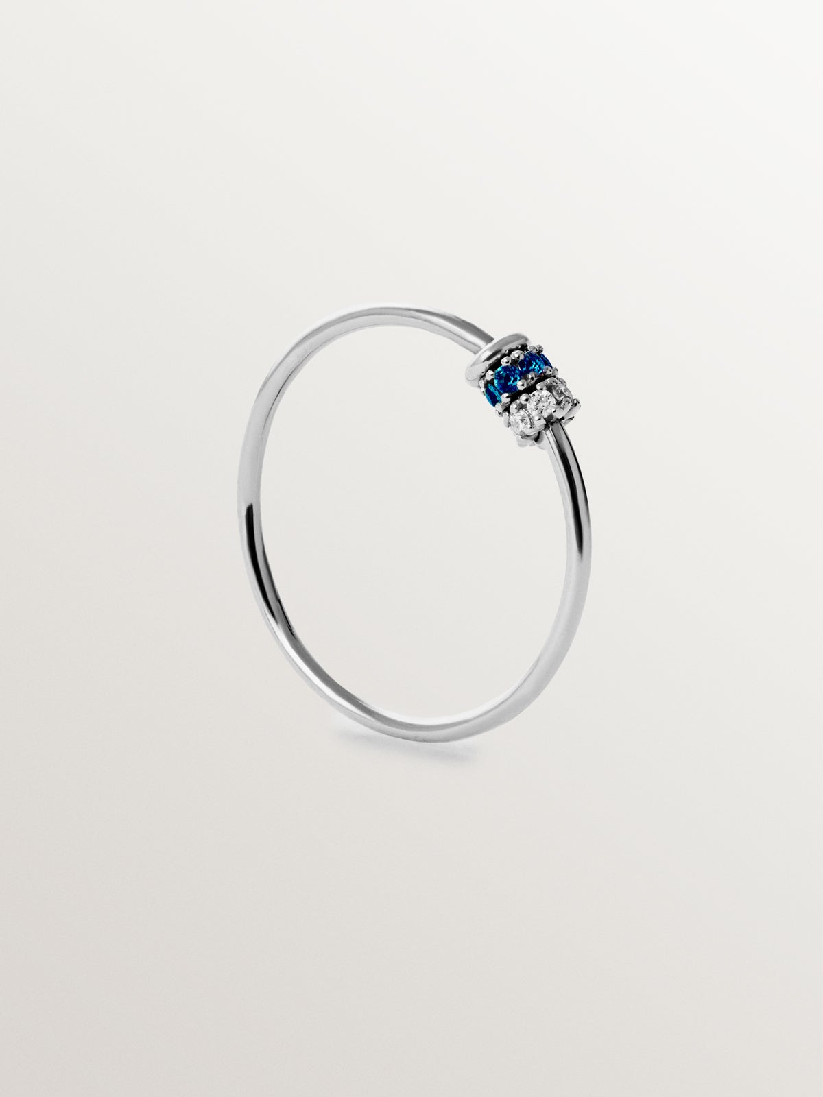 9K white gold ring with blue sapphires and diamonds