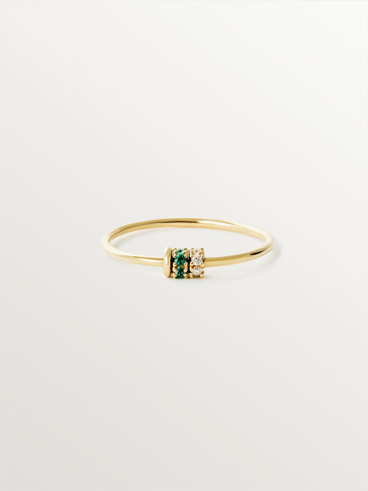 9K yellow gold ring with emeralds and diamonds