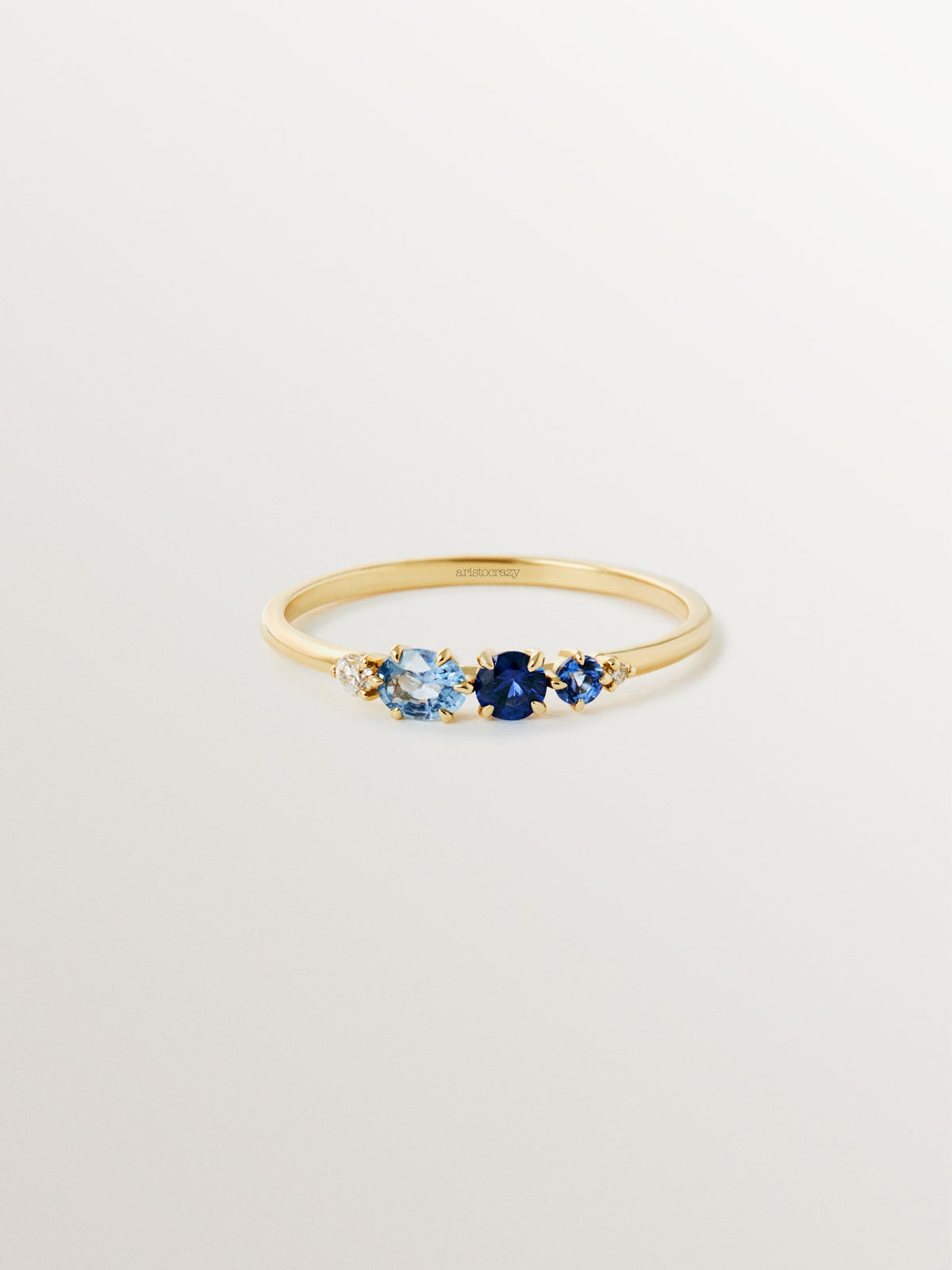9K yellow gold ring with blue sapphires and diamonds