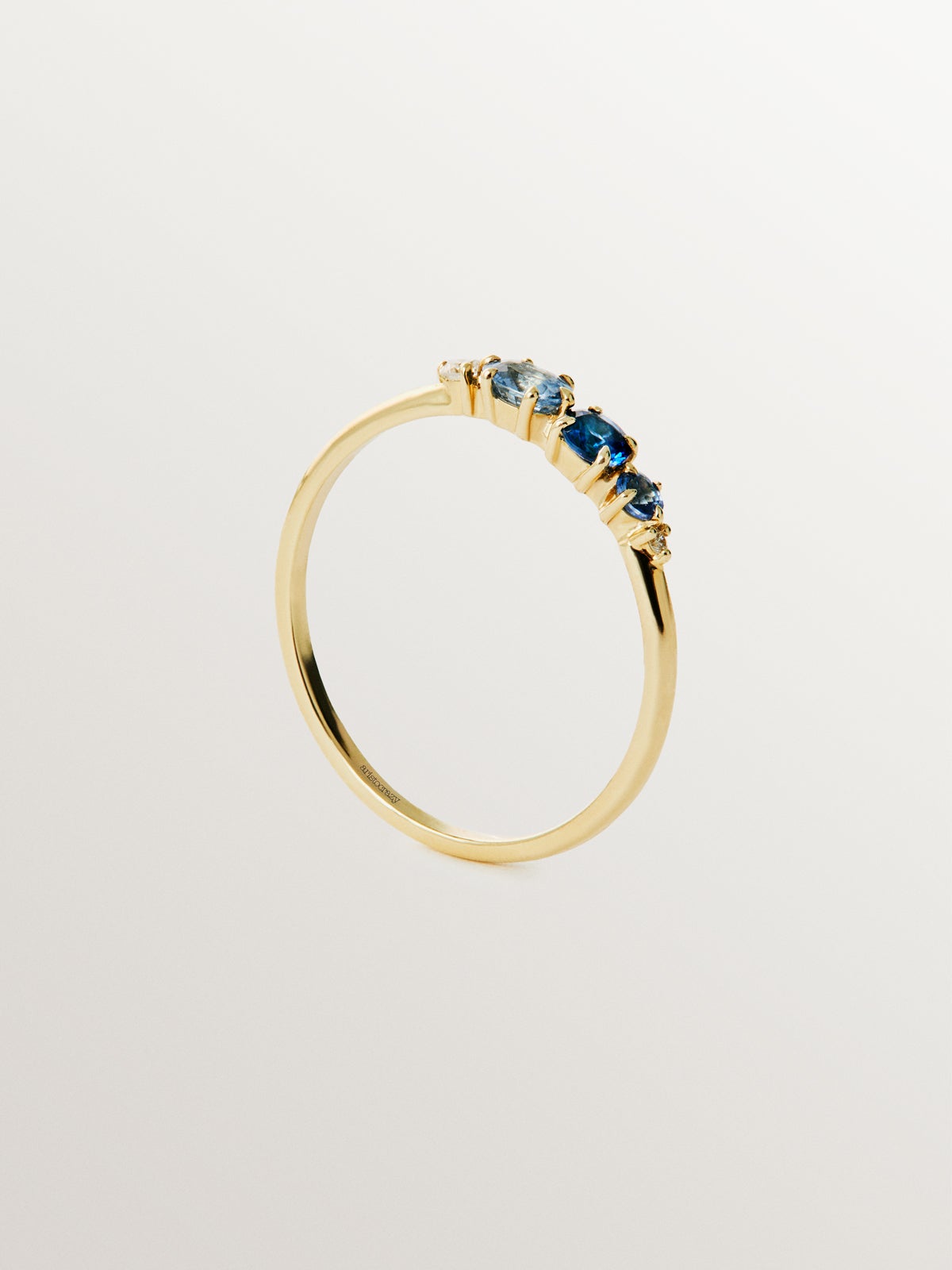 9K yellow gold ring with blue sapphires and diamonds