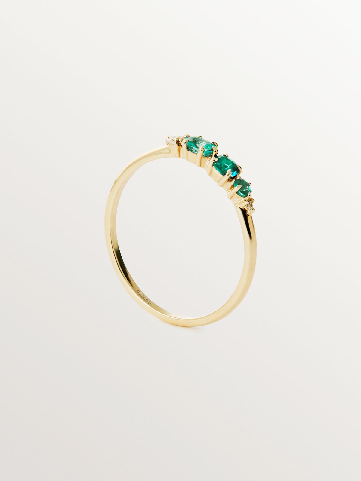 9K yellow gold ring with emeralds and diamonds