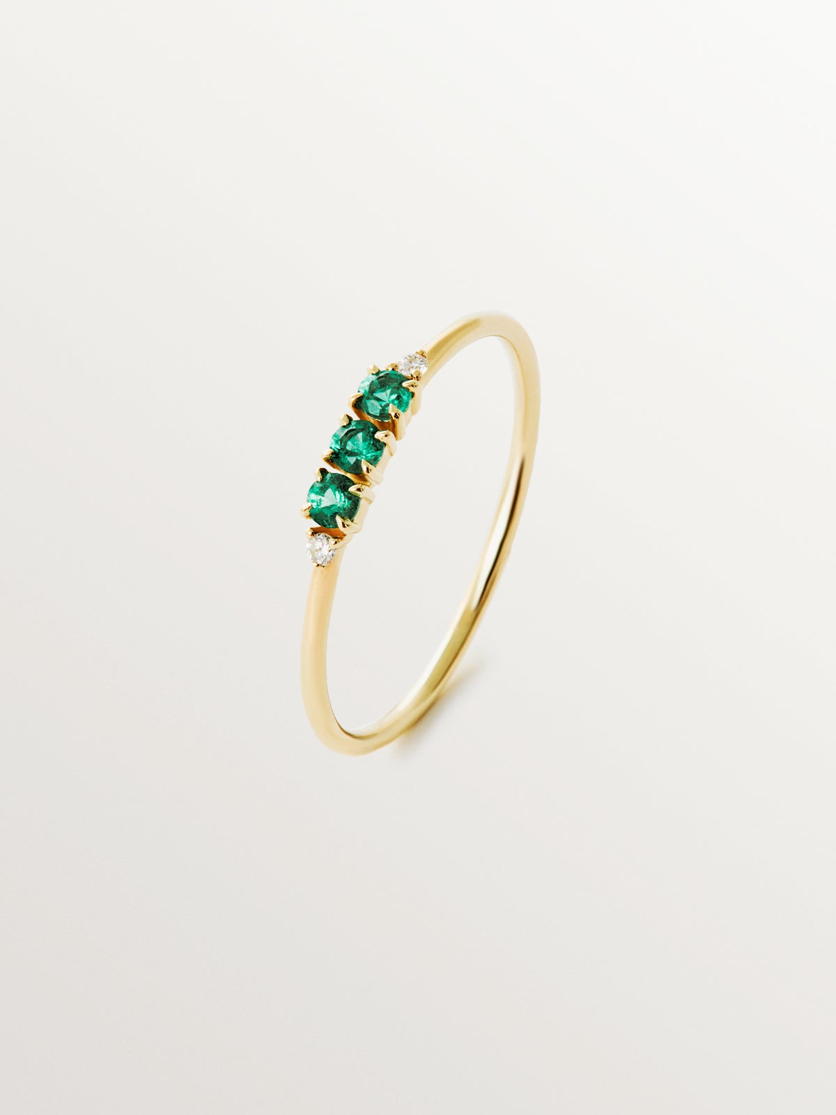 9K yellow gold ring with emeralds and diamonds