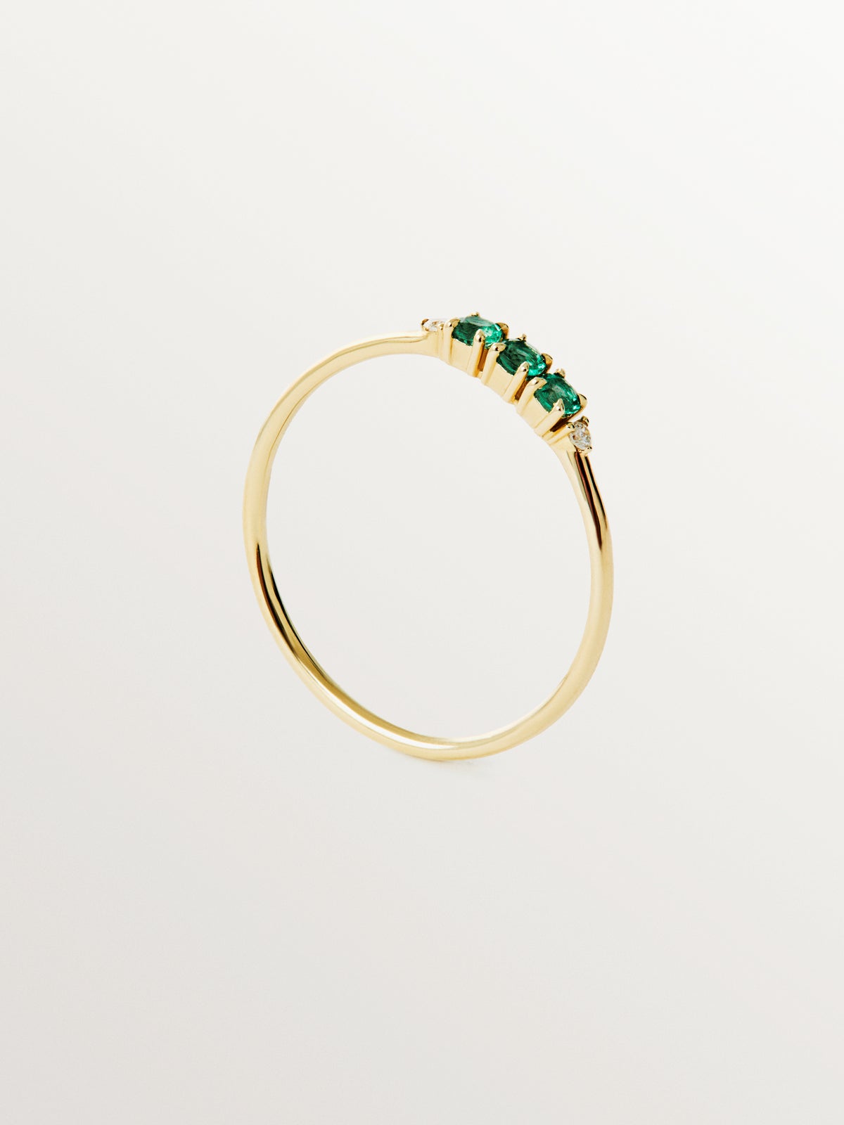 9K yellow gold ring with emeralds and diamonds
