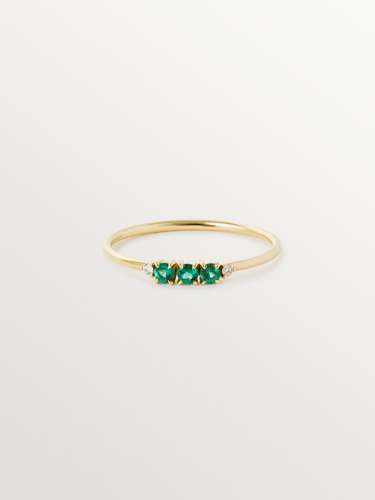 9K yellow gold ring with emeralds and diamonds