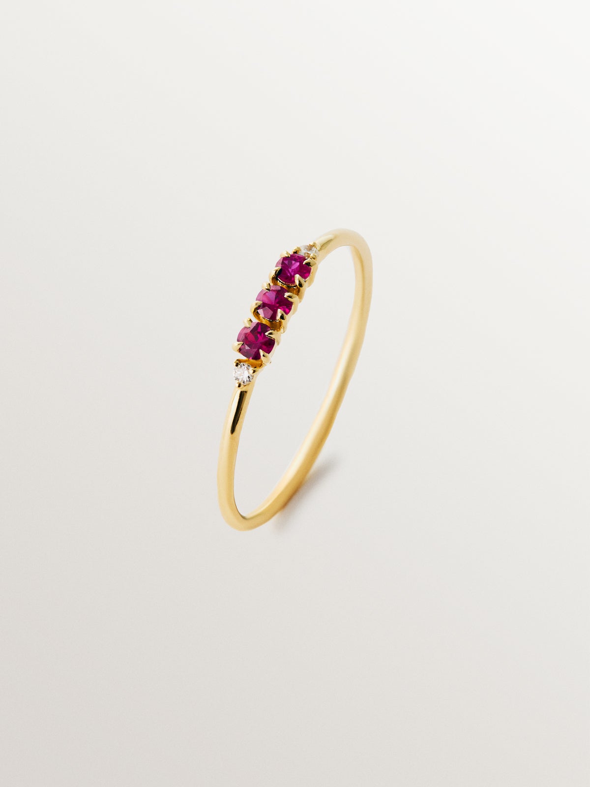 9K yellow gold ring with rubies and diamonds