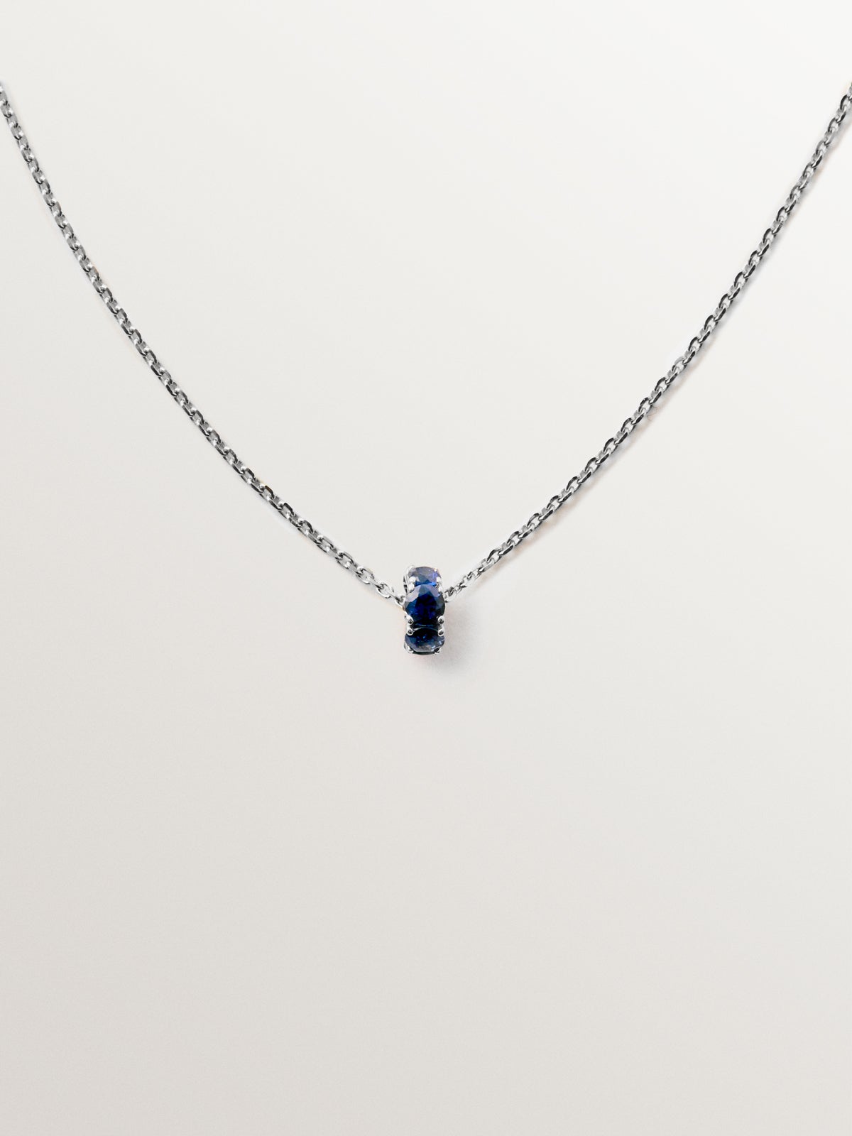 9K white gold pendant with blue sapphires and diamonds