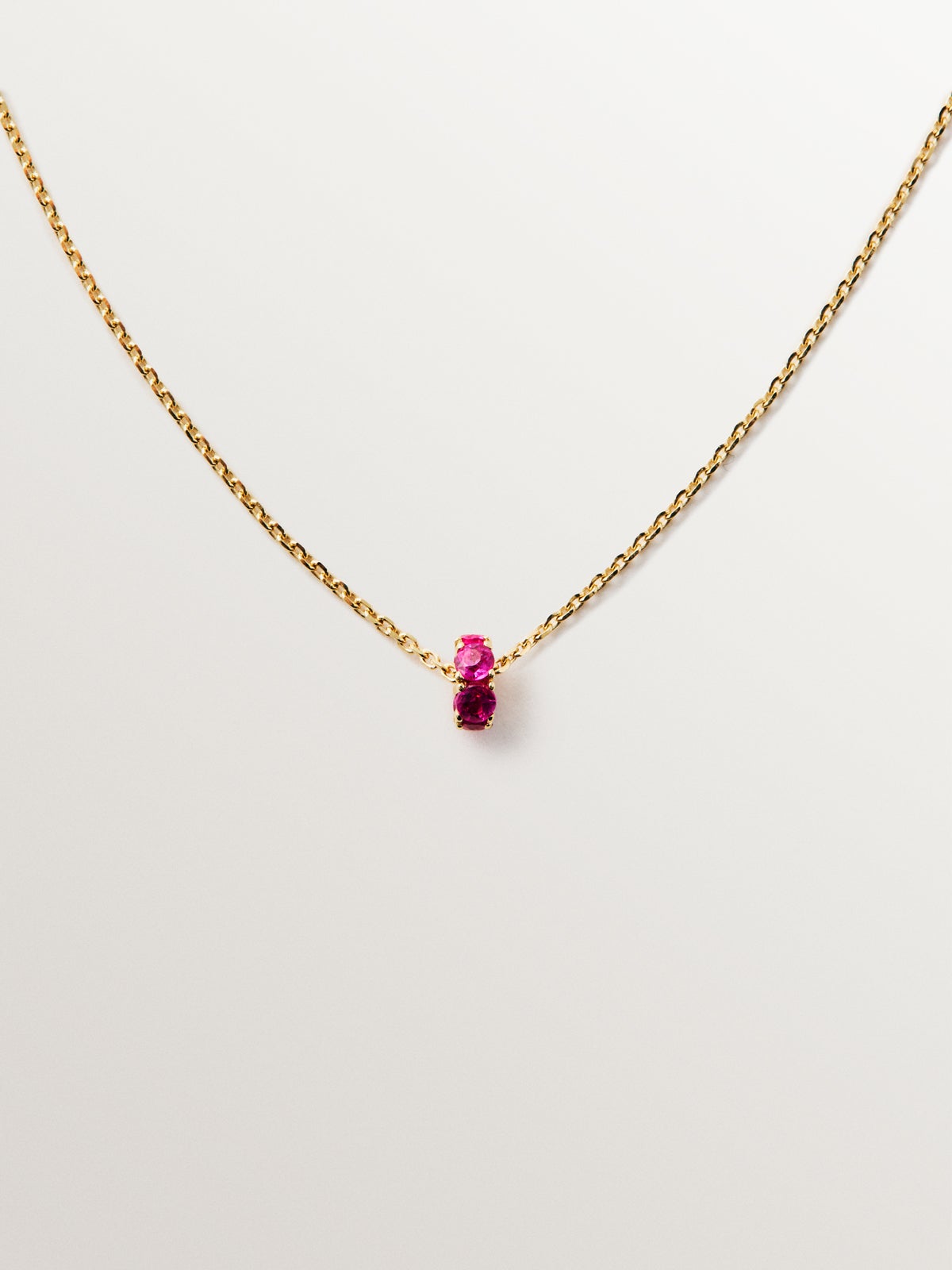 9K yellow gold pendant with rubies and diamonds