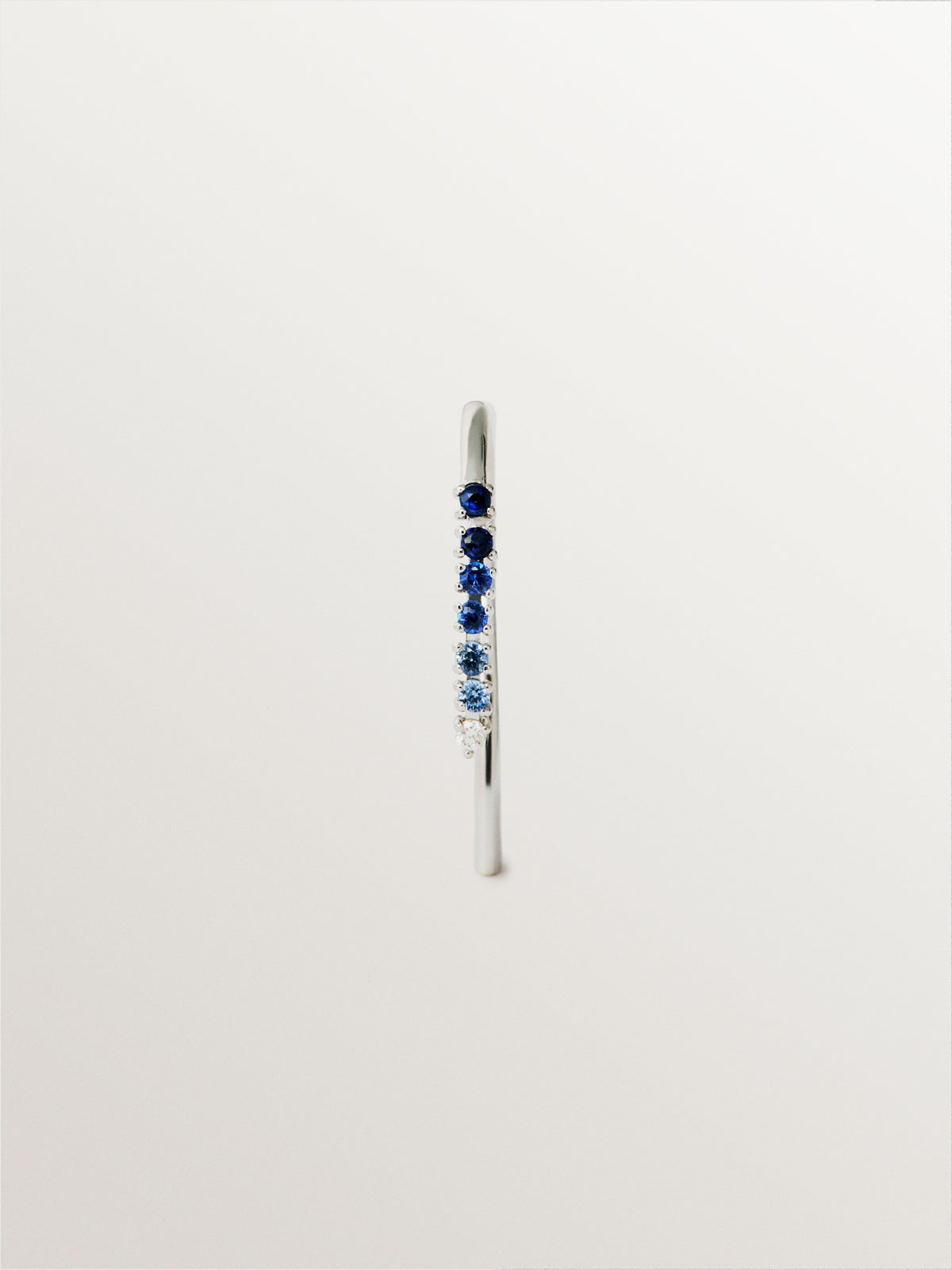 9K white gold single earring with blue sapphires and diamonds