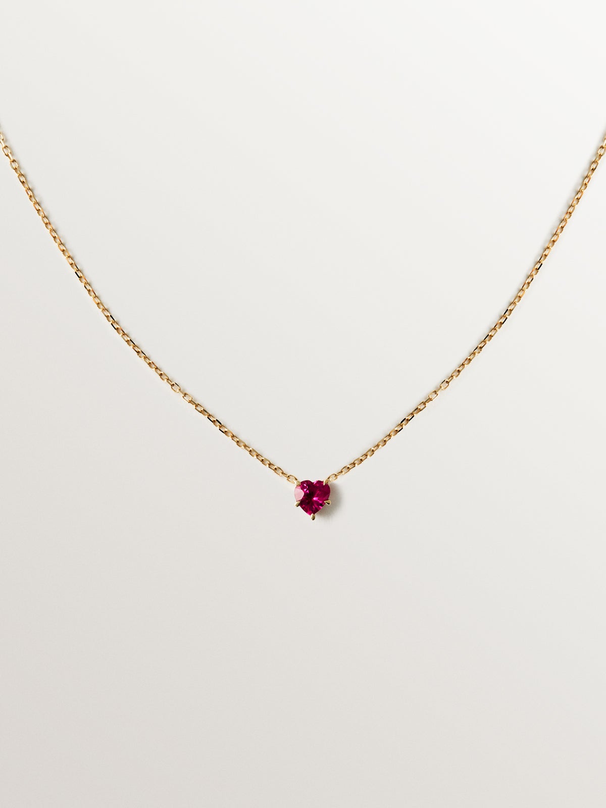 9K yellow gold pendant with heart-cut red ruby