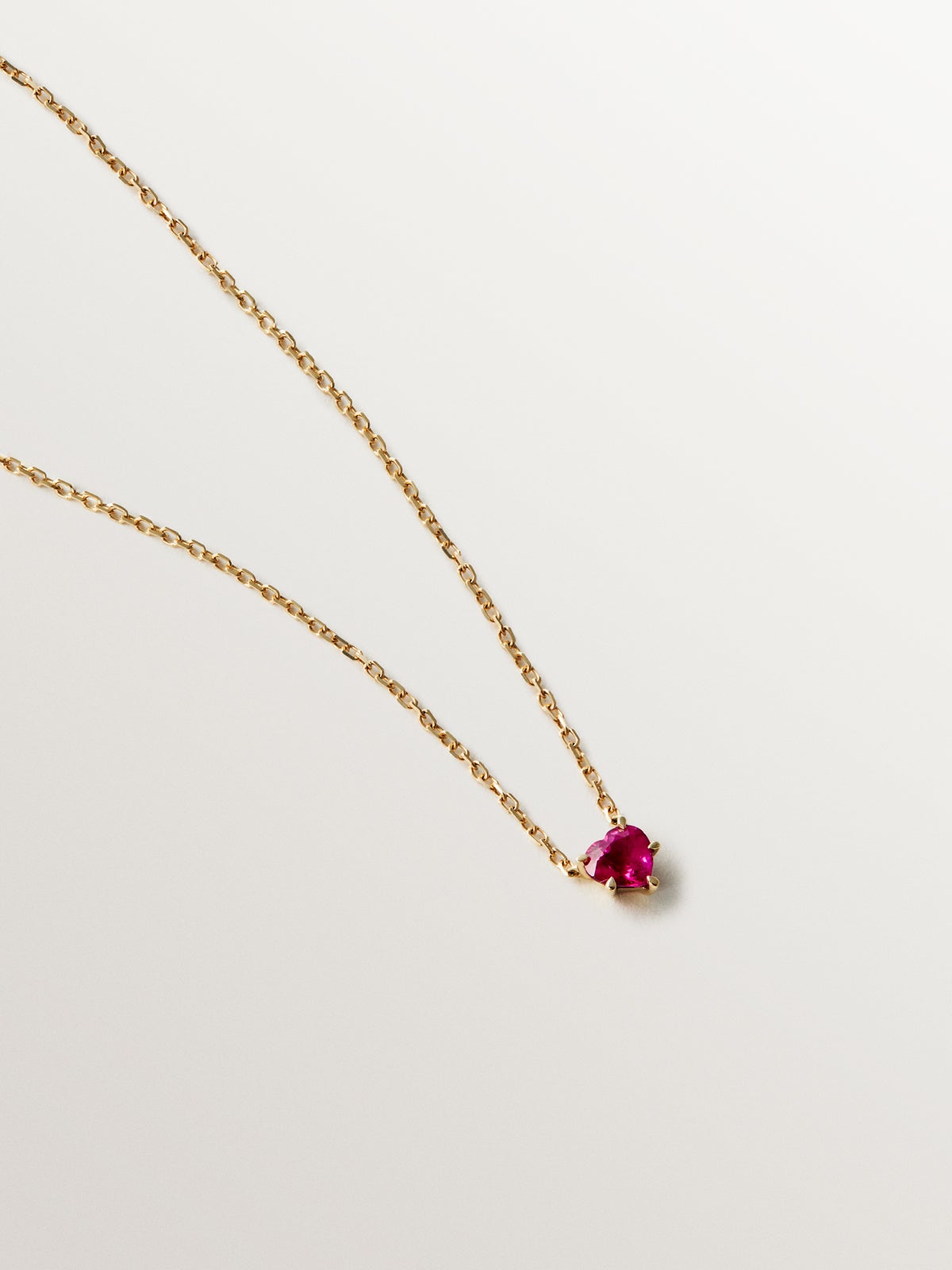 9K yellow gold pendant with heart-cut red ruby