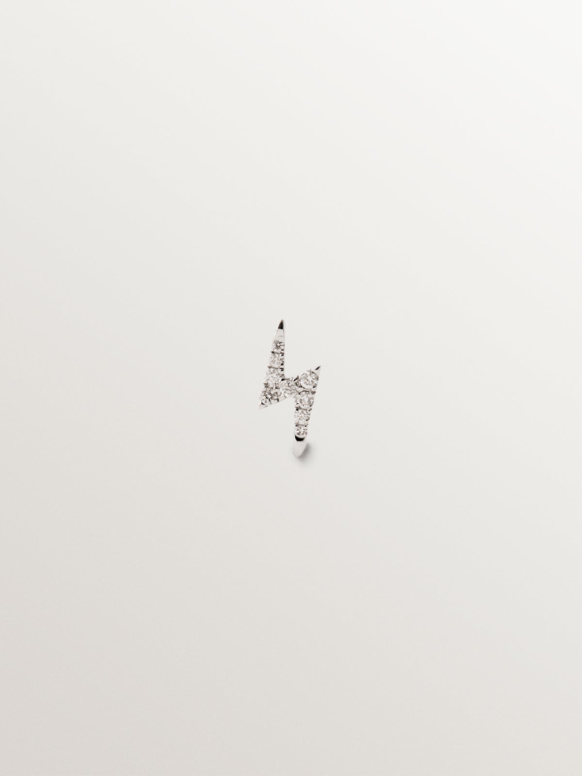 18K white gold piercing with brilliant-cut diamonds and lightning bolt shape