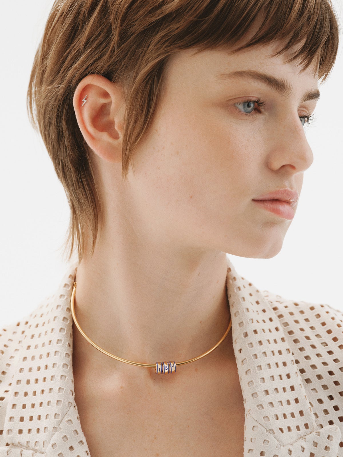 18K white gold piercing with brilliant-cut diamonds and lightning bolt shape