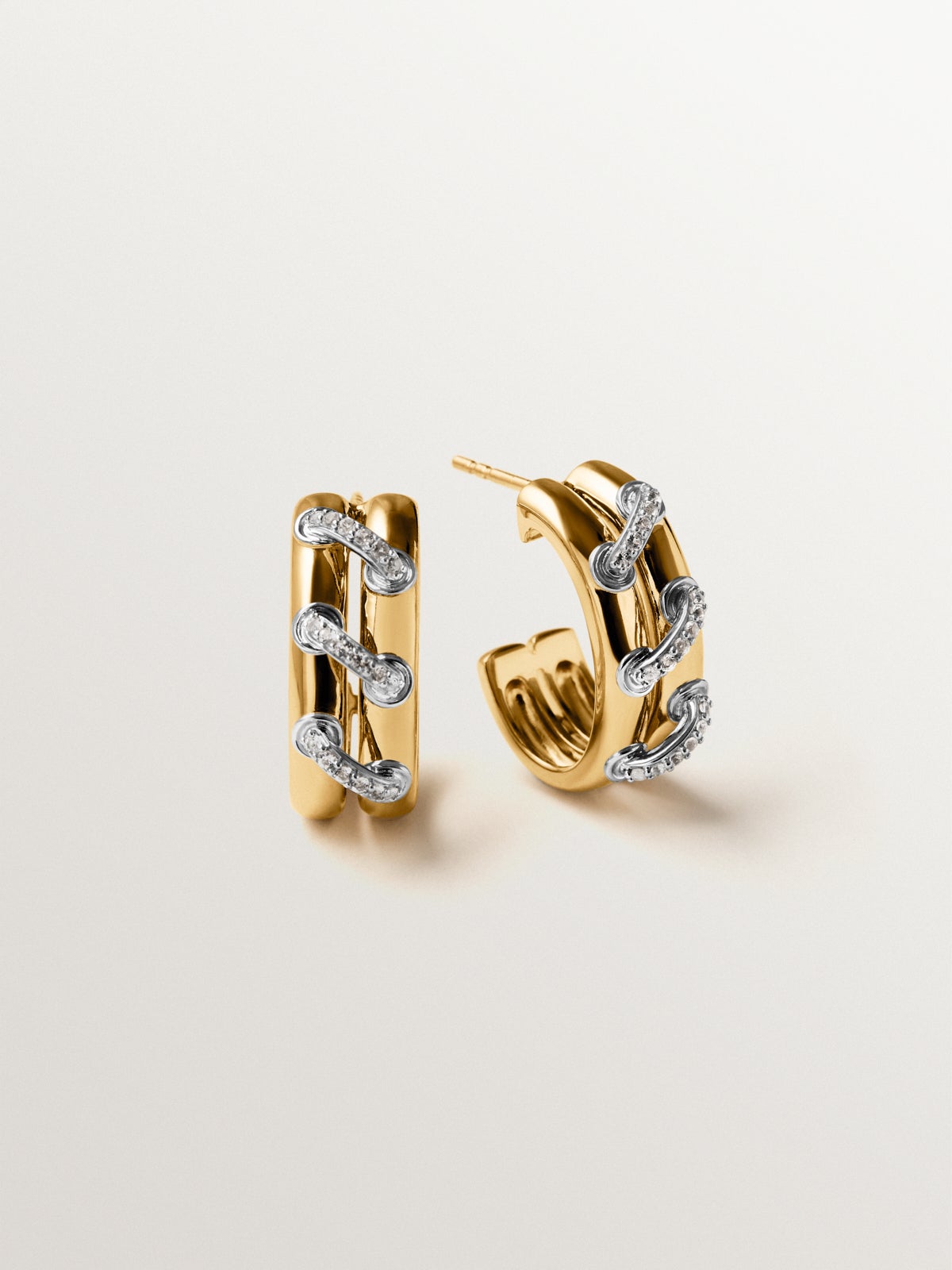 925 sterling silver hoop earrings plated with rhodium and 18K yellow gold with white topaz pavé