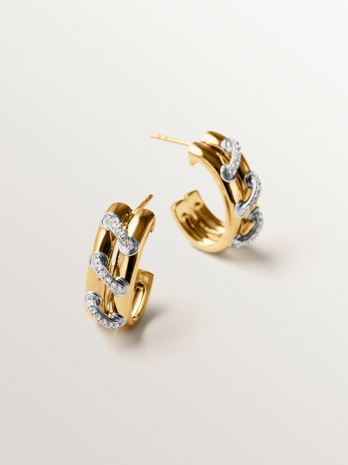 925 sterling silver hoop earrings plated with rhodium and 18K yellow gold with white topaz pavé
