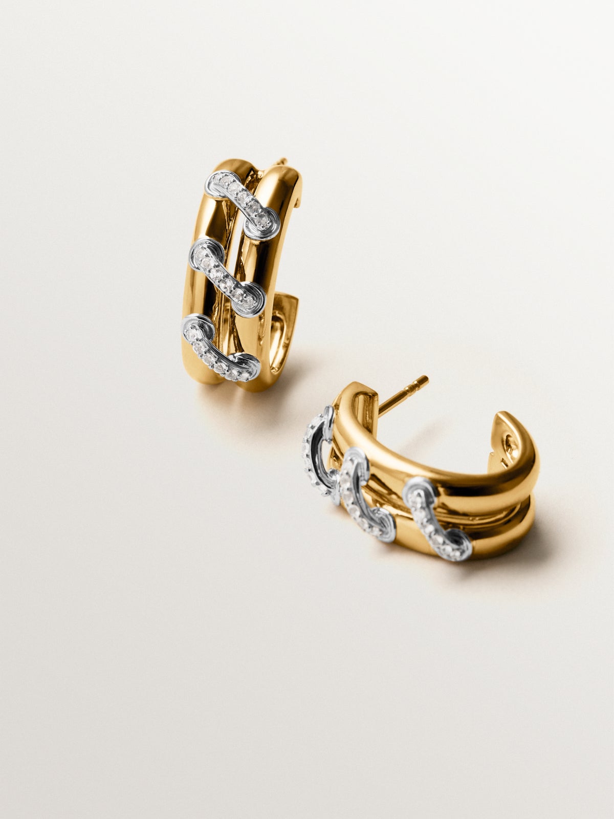 925 sterling silver hoop earrings plated with rhodium and 18K yellow gold with white topaz pavé