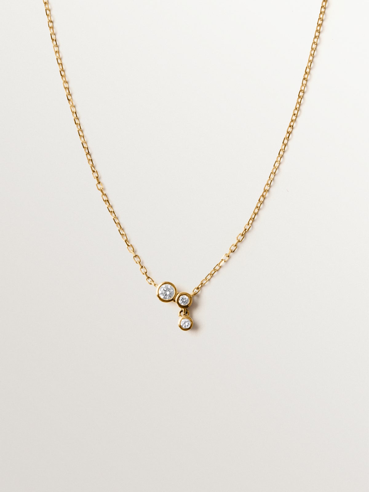9K yellow gold necklace with three diamonds