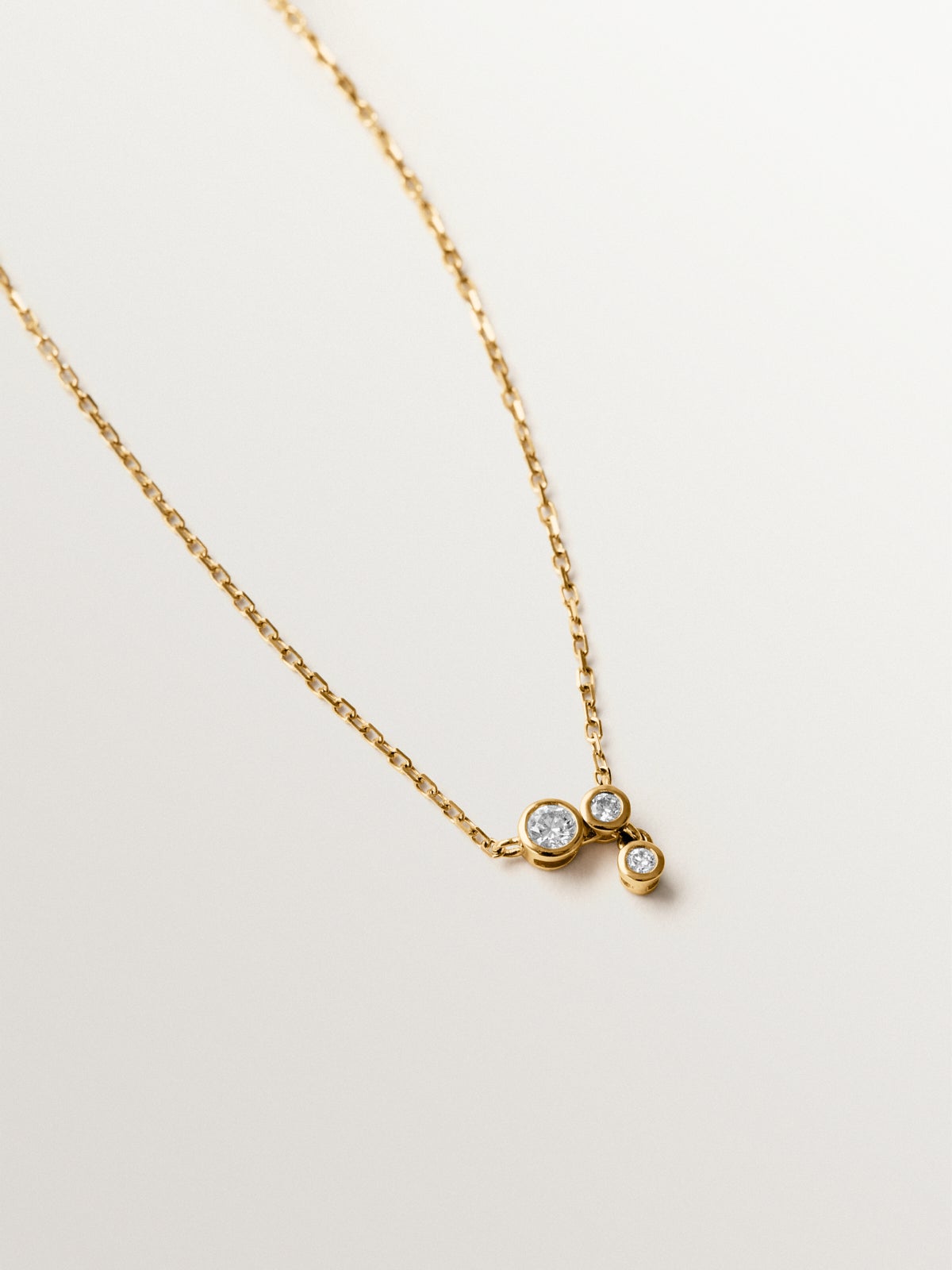 9K yellow gold necklace with three diamonds