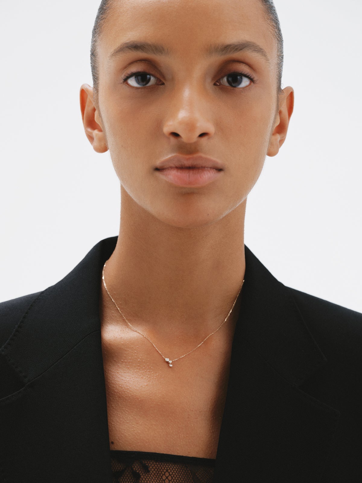 9K yellow gold necklace with three diamonds