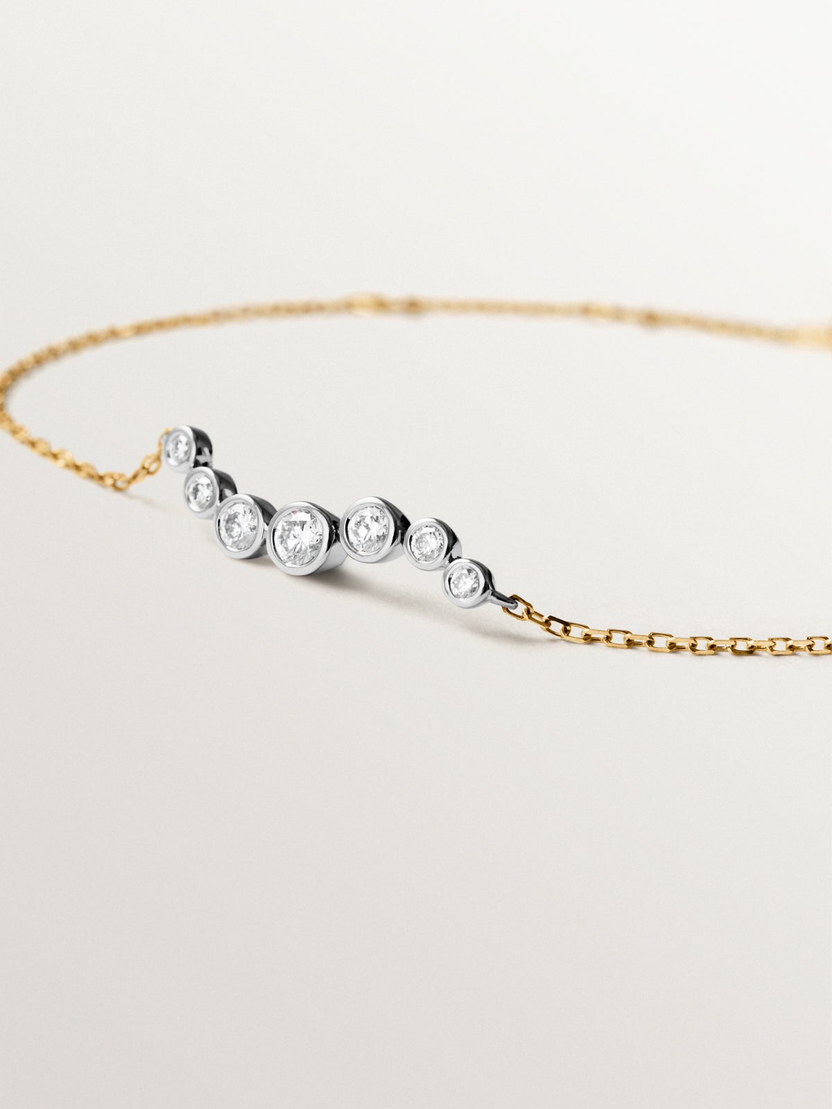 9K white and yellow gold bracelet with diamonds