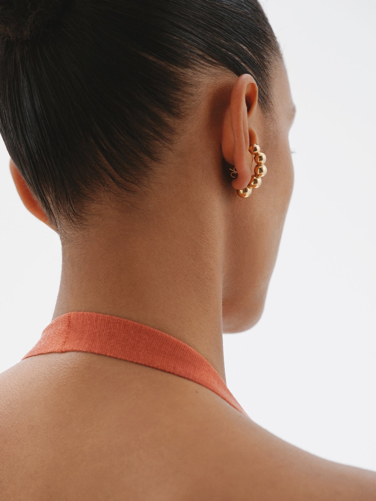 Single earring made of 925 silver plated in 18K yellow gold with spheres