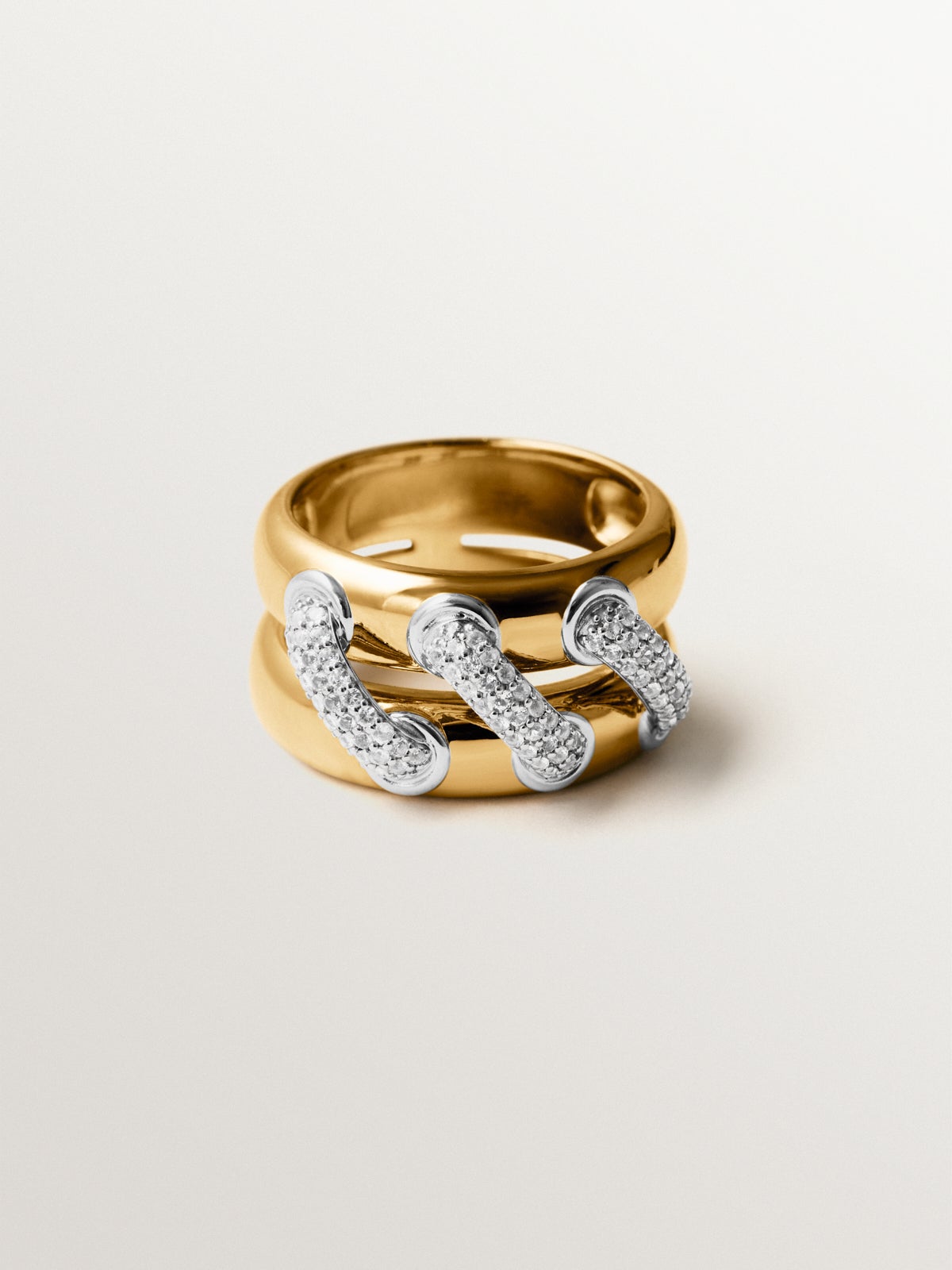 Double ring in 925 silver plated with rhodium and 18K yellow gold with white topaz pavé