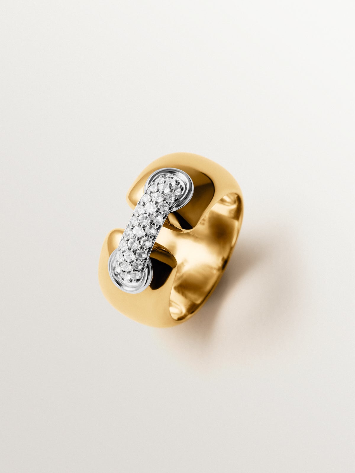 924 silver ring plated with rhodium and 18K yellow gold with white topaz pavé