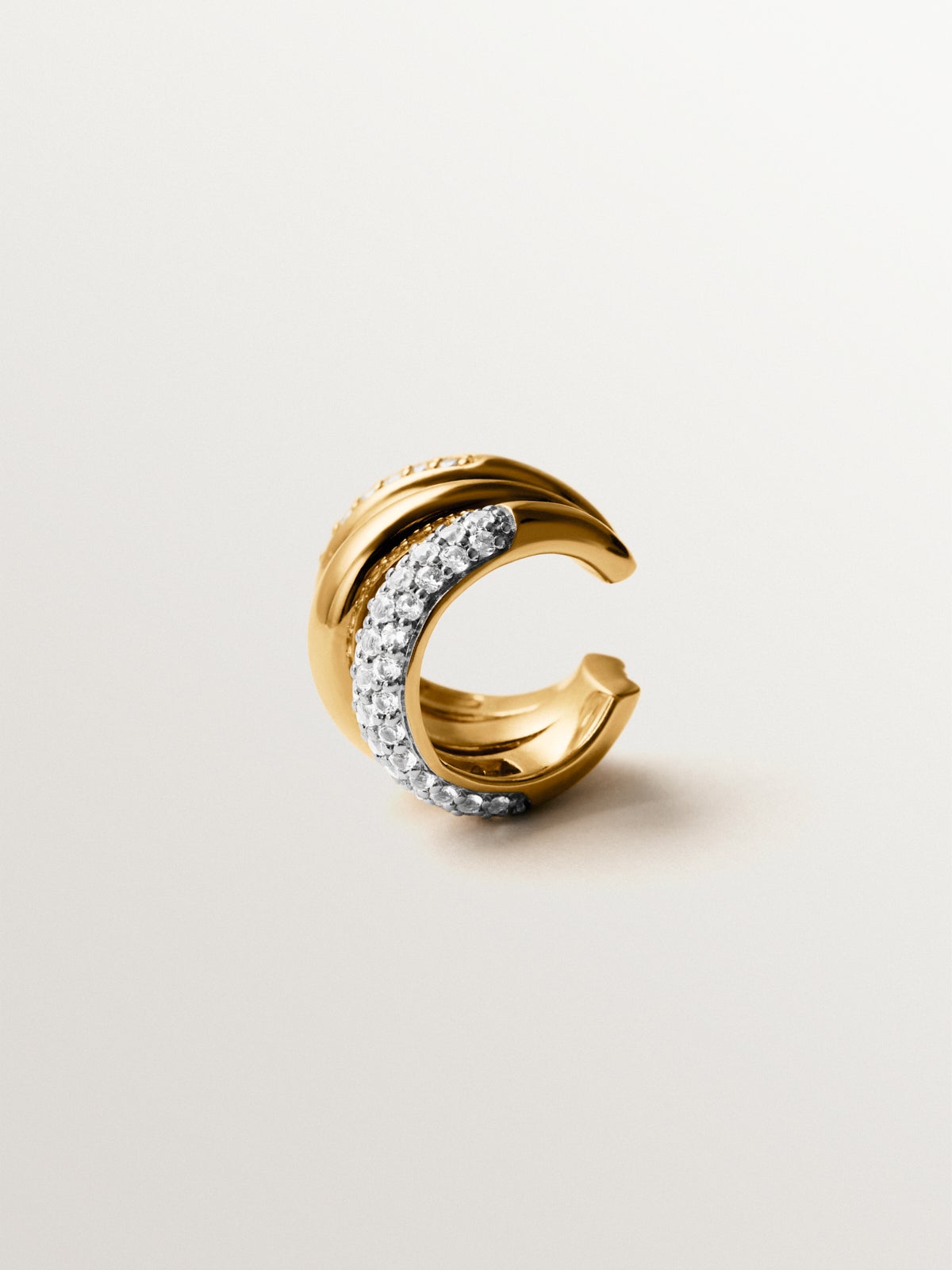 Single earcuff earring in rhodium-plated 925 silver and 18K yellow gold with topaz pavé