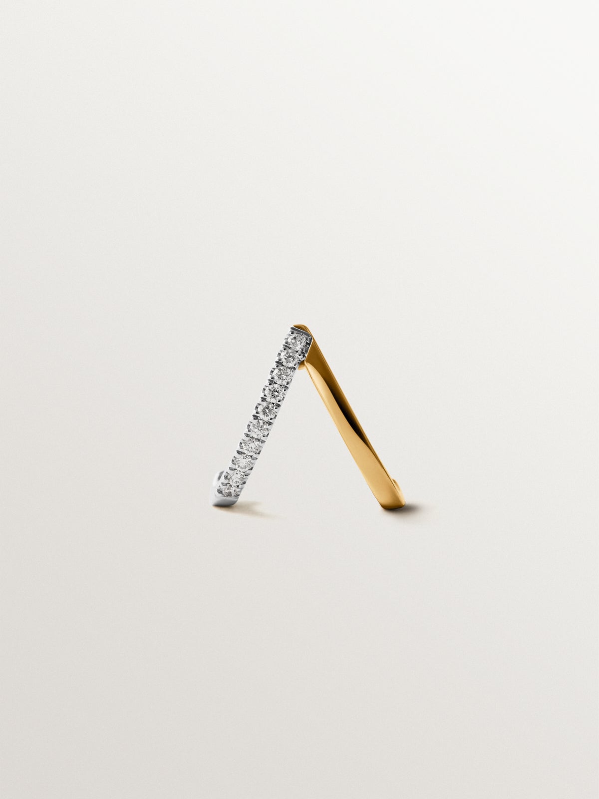 Single earring in 18K white and yellow gold with diamonds