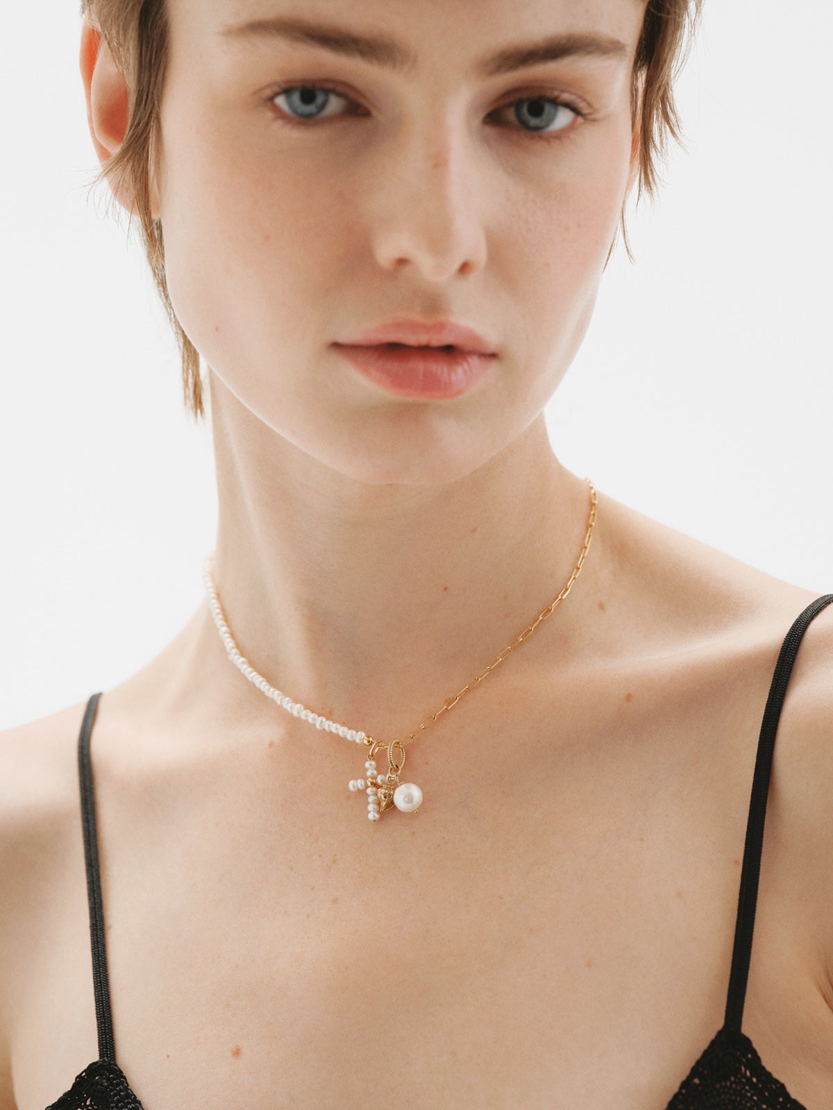 18K yellow gold plated 925 silver charm with pearls and a cross shape