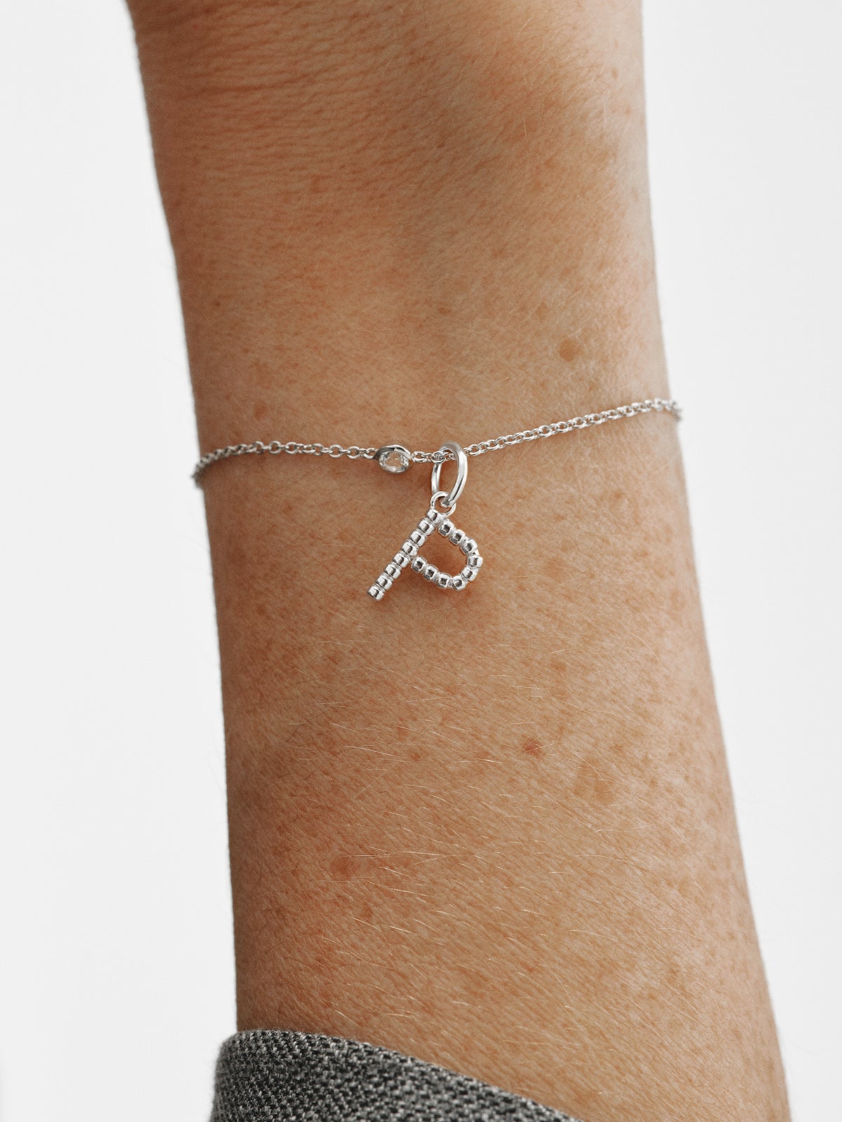 925 silver charm with letter P and sphere motifs